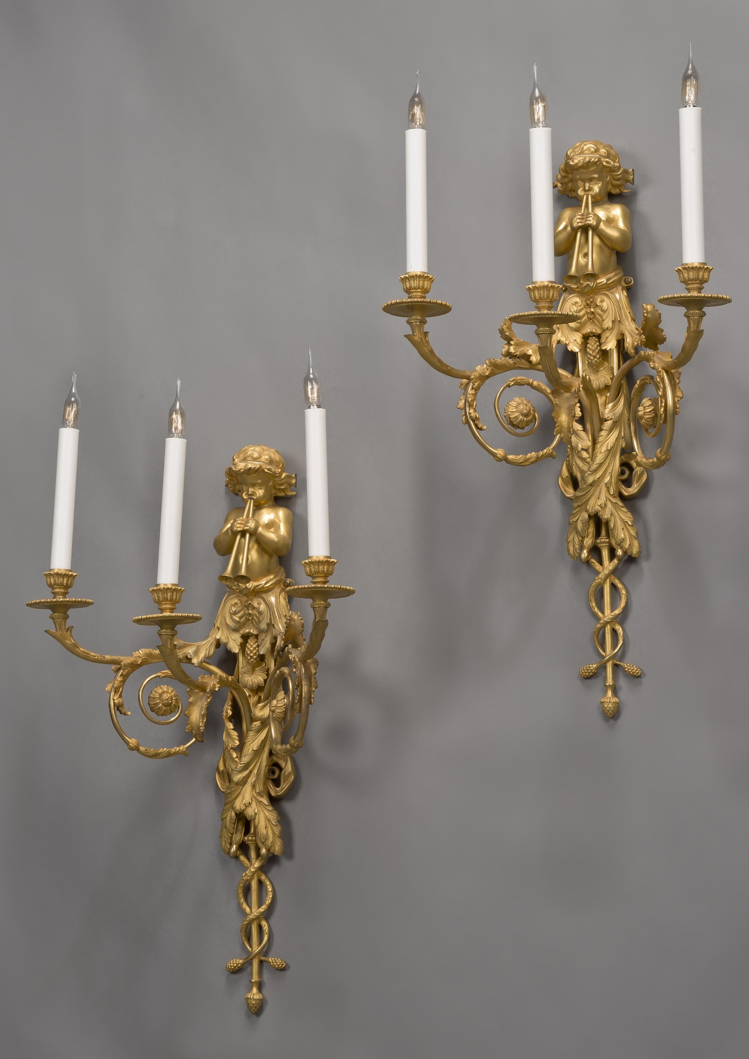 A fine pair of Louis XVI style gilt bronze three-light wall-appliques after a Design by Jean Hauré for the Château de St. Cloud.

French, circa 1890. 

Each applique has a backplate issuing three scrolling acanthus candle arms terminating in
