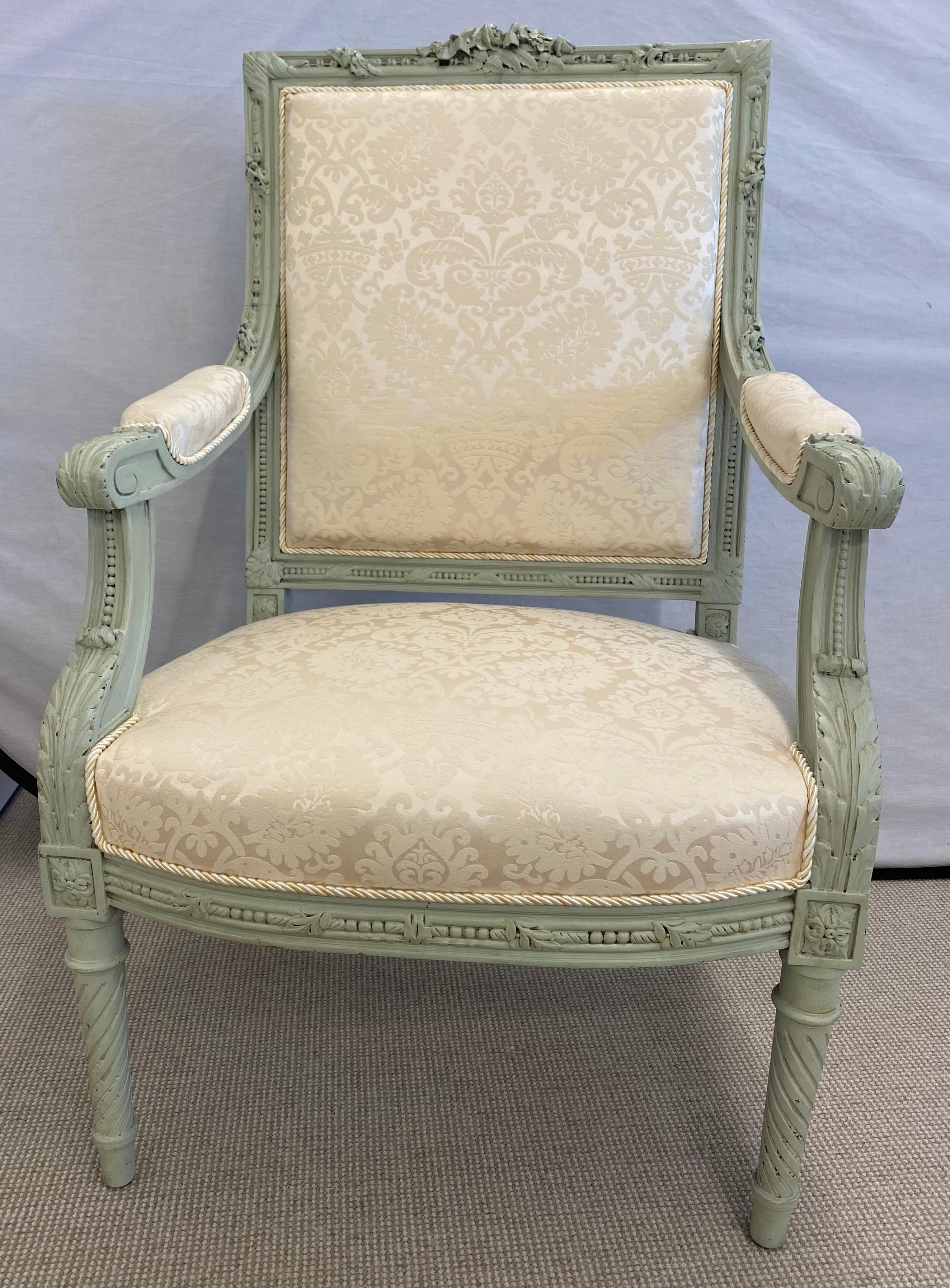 Pair of finely upholstered Louis XVI style throne or arm chairs in paint decorated frames. Each having carved twisted legs supporting stuffed seats and back rests on carved frames. Each in a fine clean upholstery. 


1xxx.