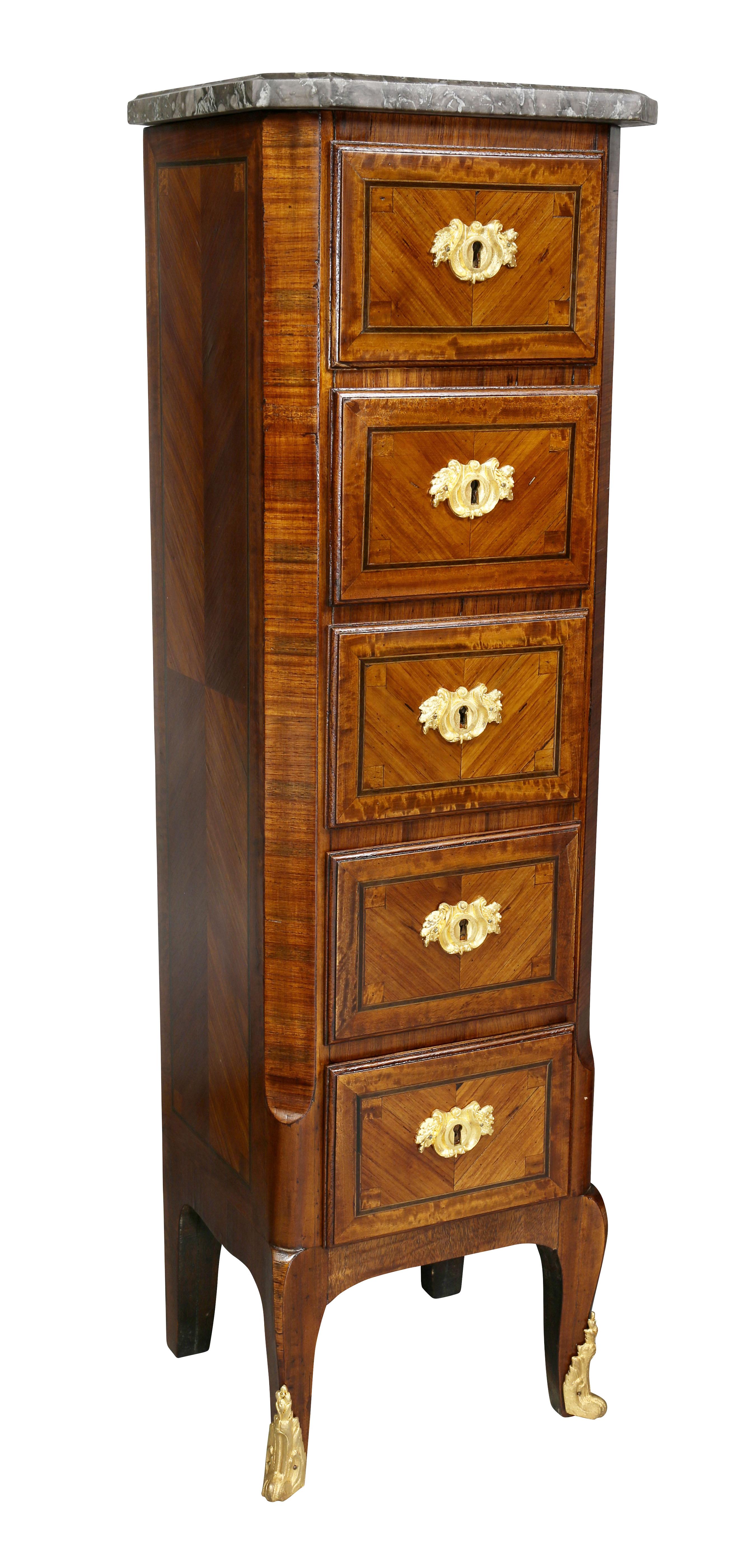 Each with a St Anne gray marble top with chamfered corners over five drawers, raised on slight cabriole legs and sabot.