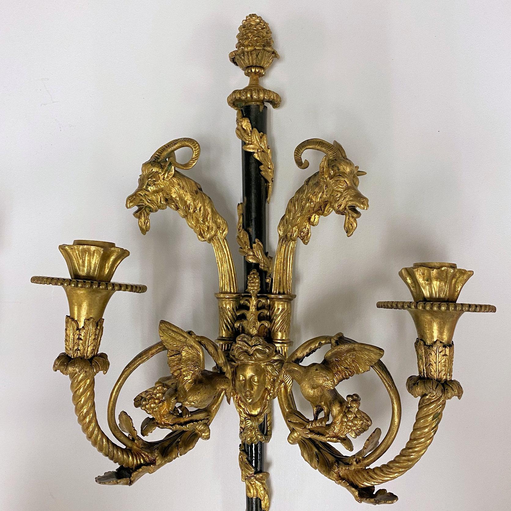 pair of French 19 century Louis XVI Style Two-Light Ormolu Bronze Sconces with Goat head motif