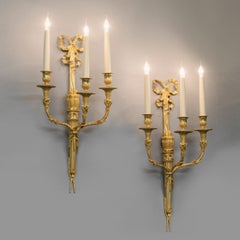 Paire d'appliques murales de style Louis XVI par Henry Dasson