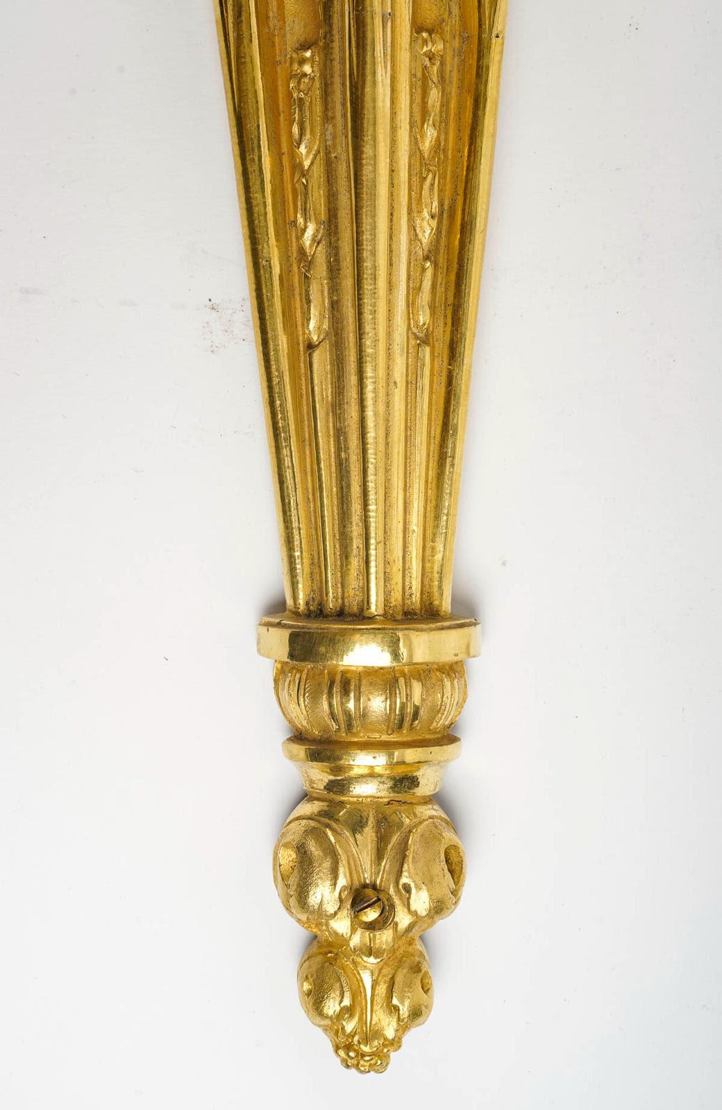 19th Century Pair of Louis XVI Style Wall Lights in Chased and Gilt Bronze.