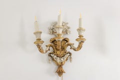 Pair of Louis XVI style wall lights in gilded and lacquered wood. Circa 1900.