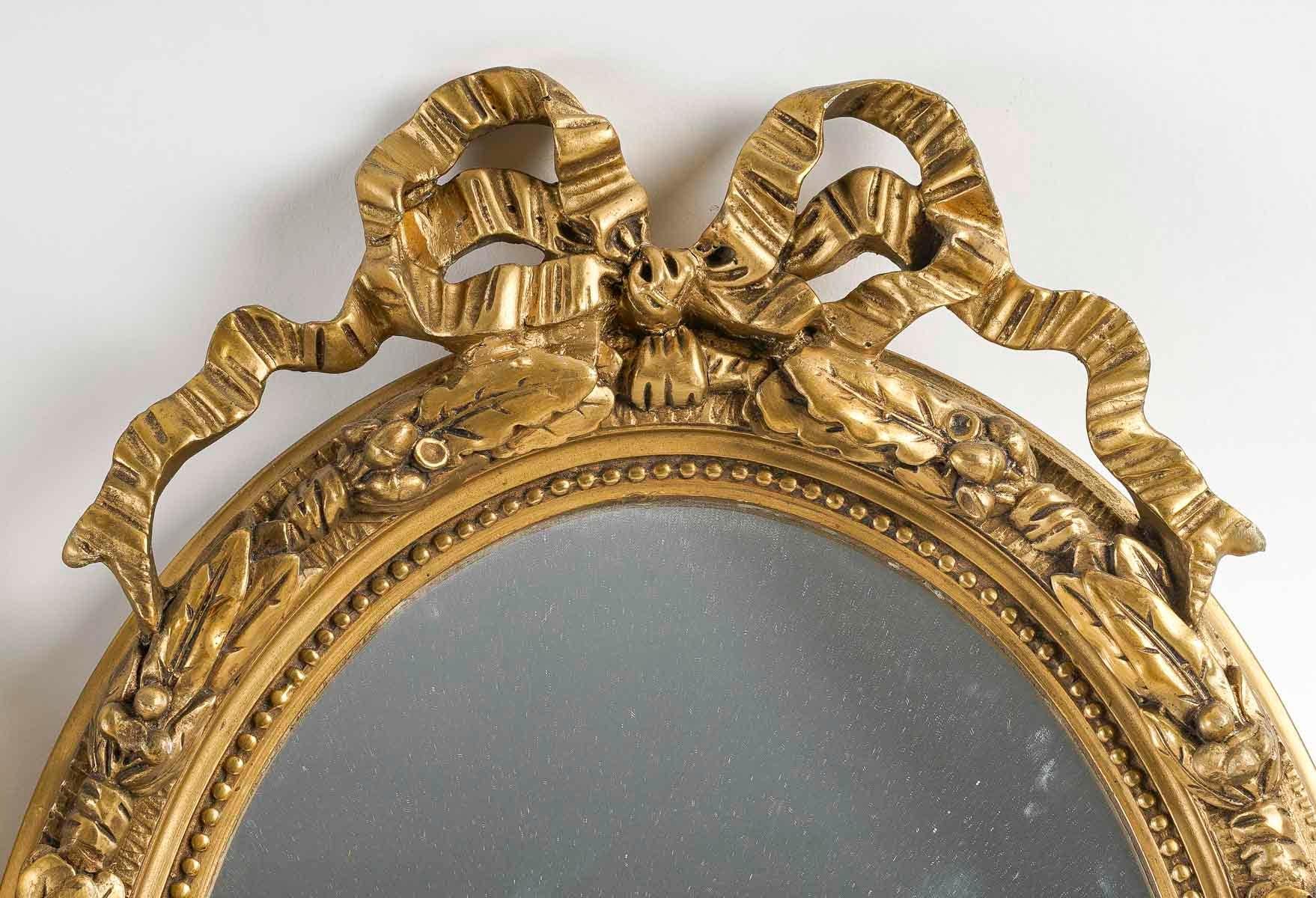 Pair of Louis XVI Style Wood and Gilded Stucco Mirrors, Early 20th Century.

Pair of wooden and gilded stucco mirrors, early 20th century, Louis XVI style.
h:55cm, w: 37cm, d: 5,5cm