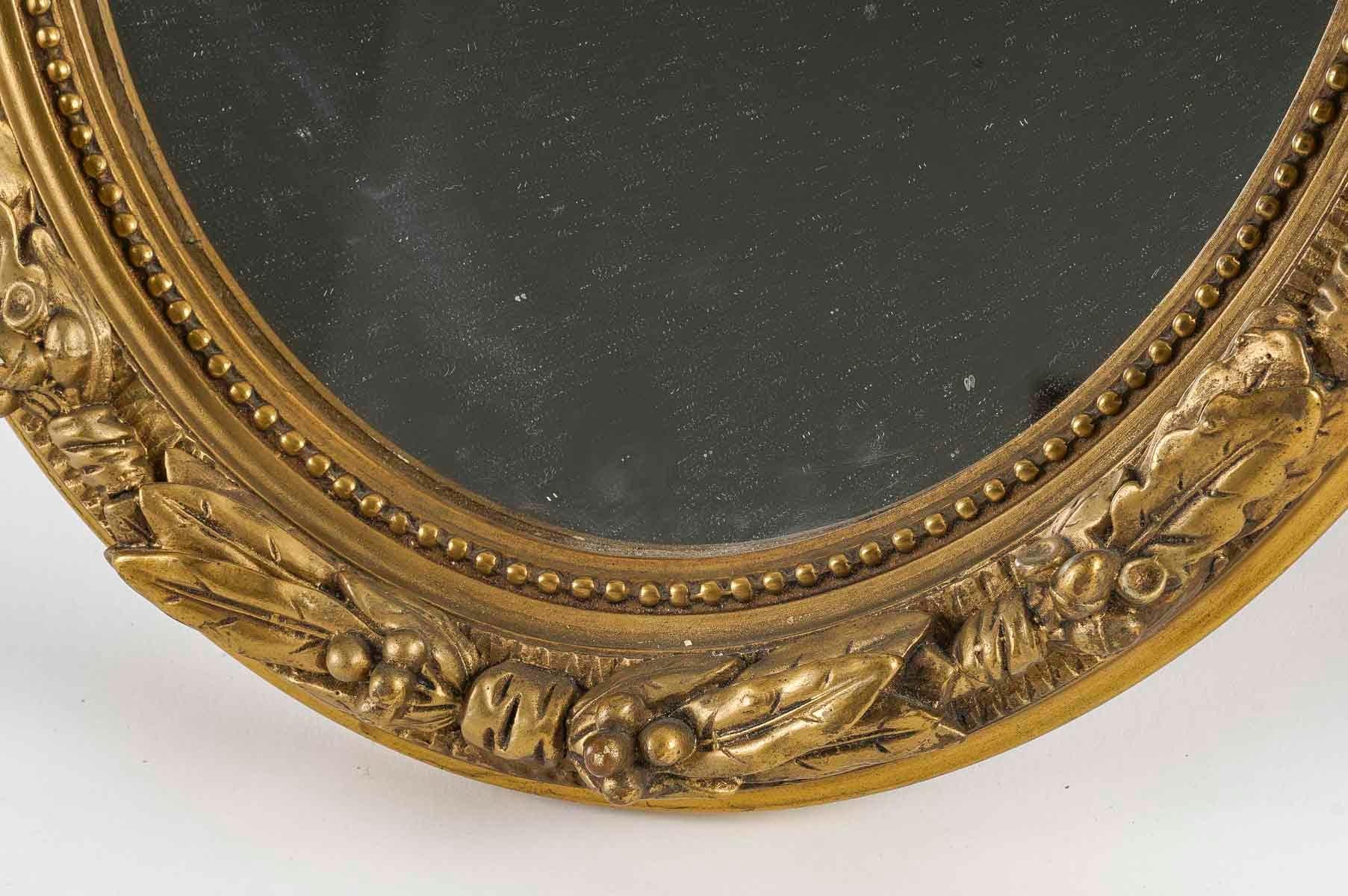 Gilt Pair of Louis XVI Style Wood and Gilded Stucco Mirrors, Early 20th Century. For Sale