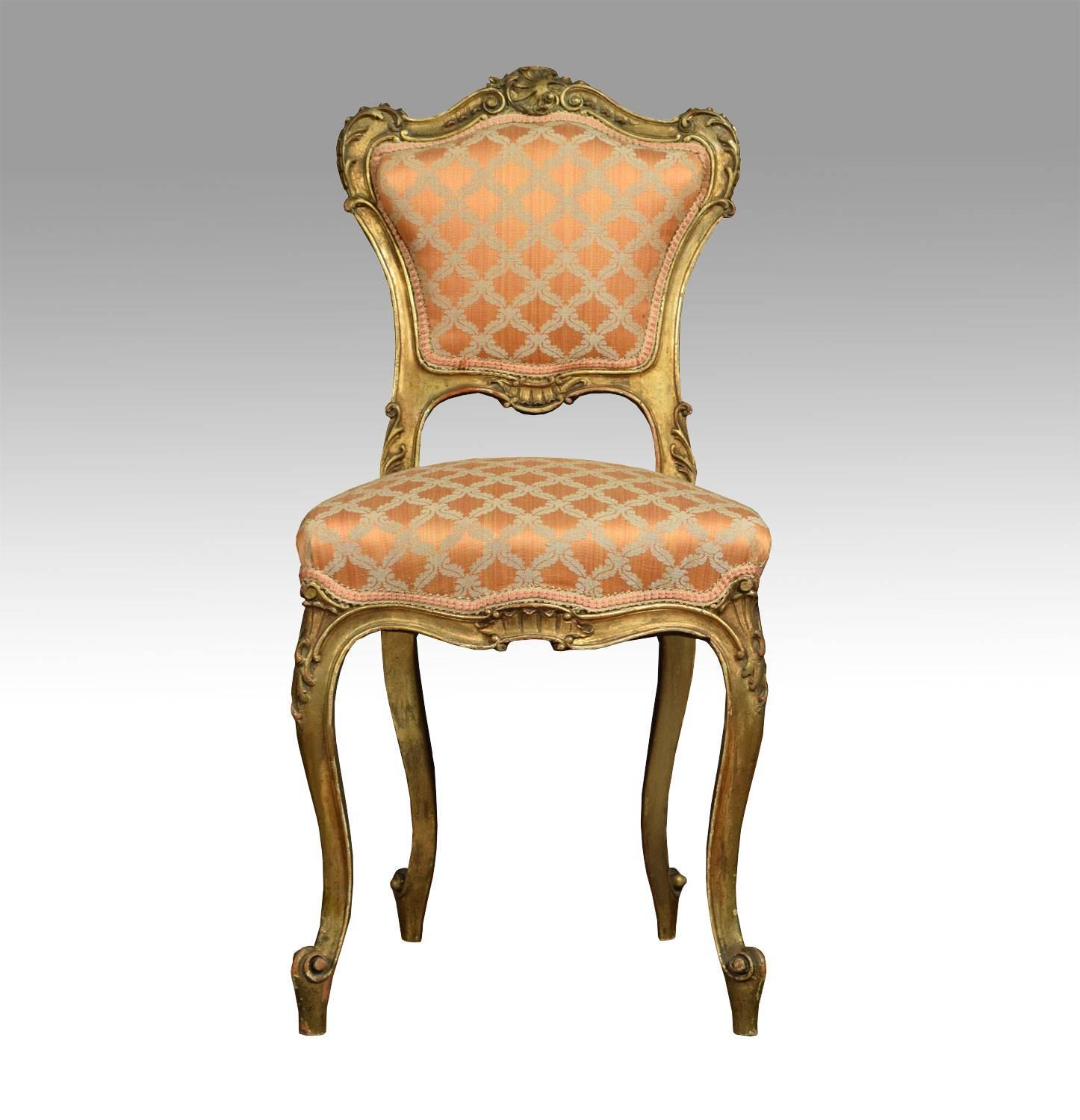 Pair of Louis XVL style giltwood side chairs with a shell crest and leaf swept scrolling frame, the padded back above serpentine stuff over seat, all raised up on curvilinear front legs terminating in scroll toes.

Dimensions:

Height 35 inches.