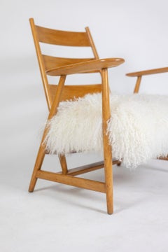 Paire de fauteuils "lounge" en hêtre blond. 1950s