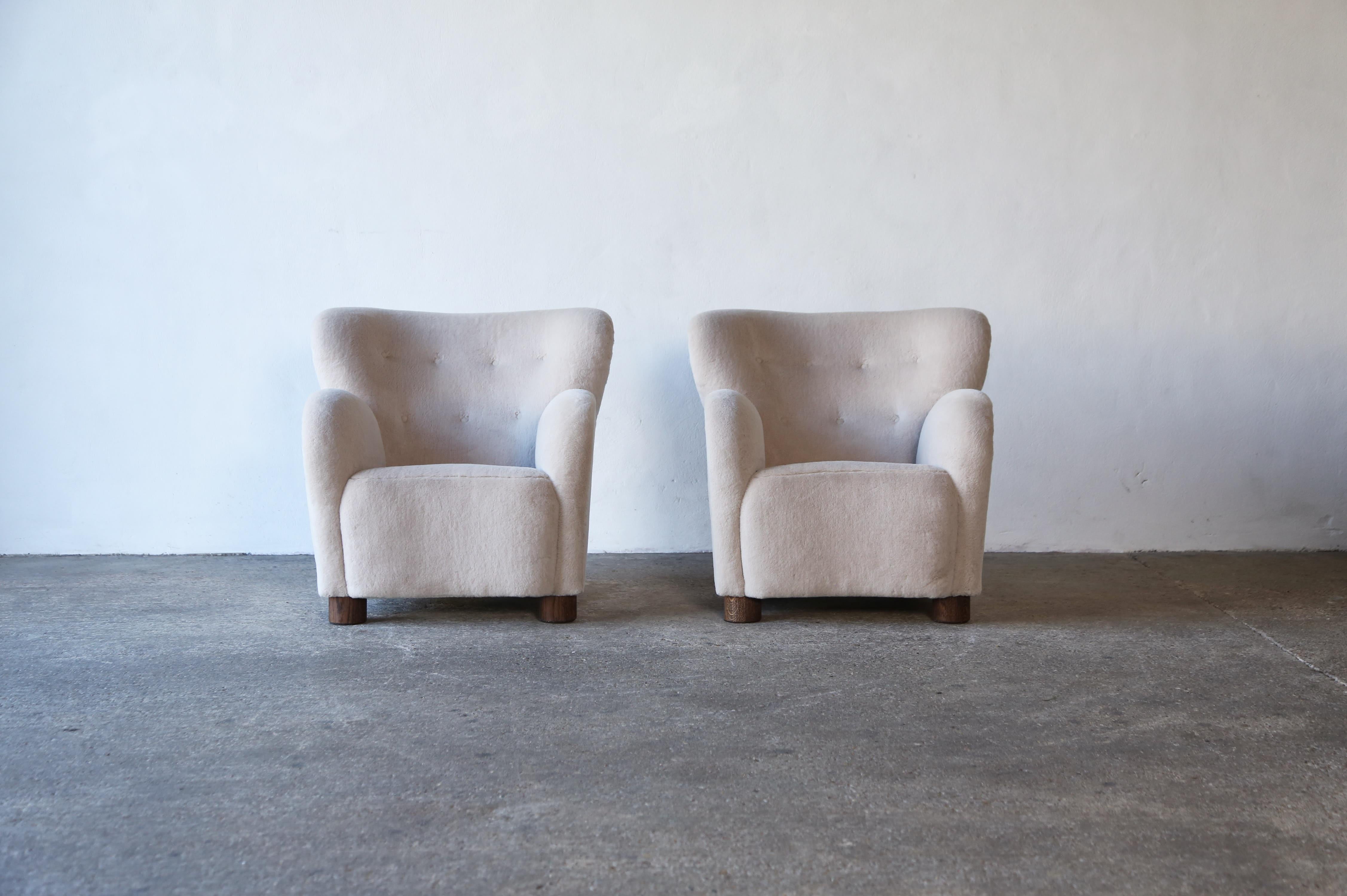 A superb pair of modern lounge chairs / armchairs.  Beech frames and sprung seats.  Newly upholstered in a premium, soft, pure alpaca wool fabric with solid oak feet.  Handmade in England.  Fast shipping worldwide.


