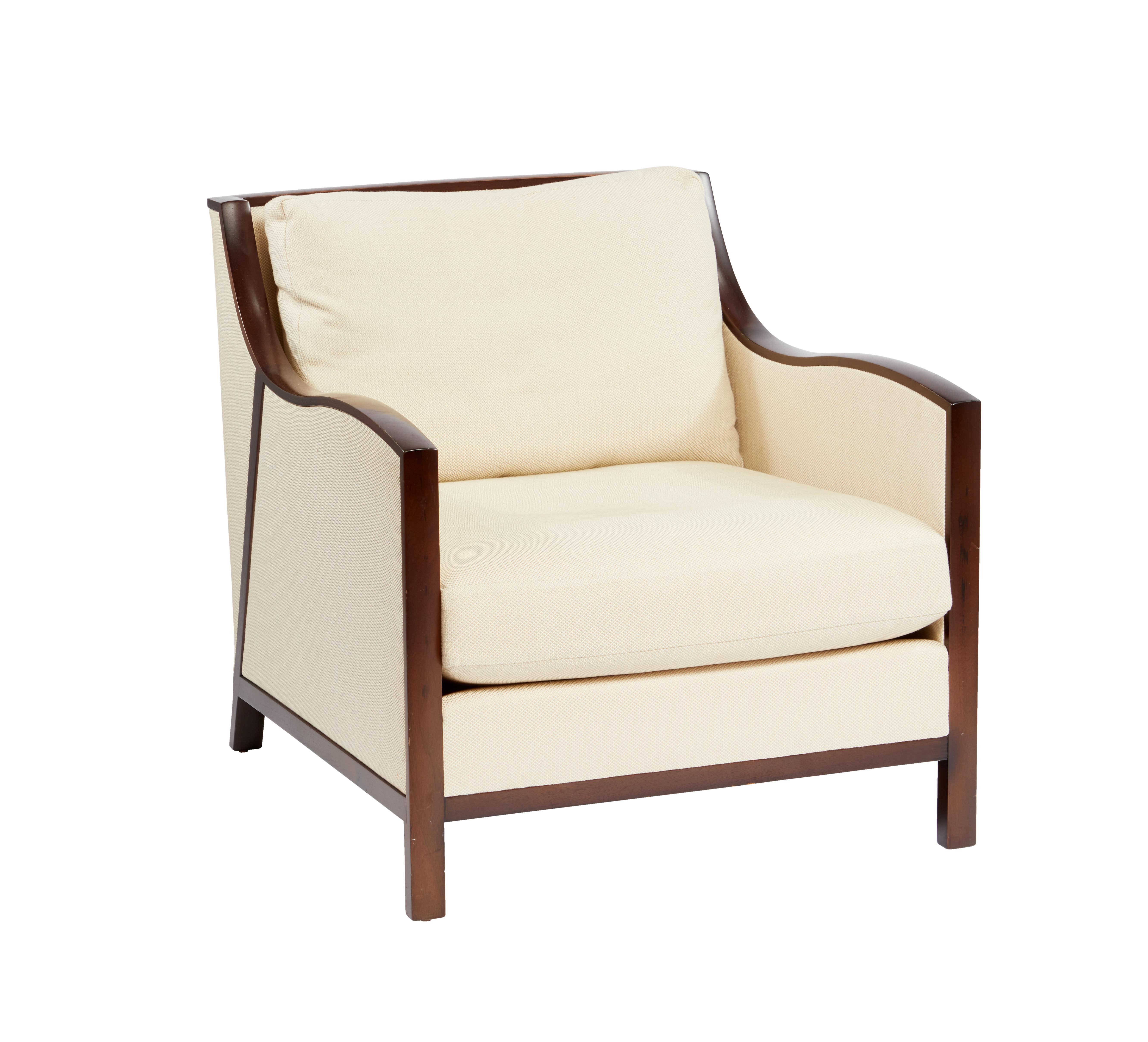 Extremely comfortable, this pair of lounge chairs were designed by John Hutton for Holly Hunt. They have a wonderful unique design, built in beech wood with a stained mahogany wood frame. 
