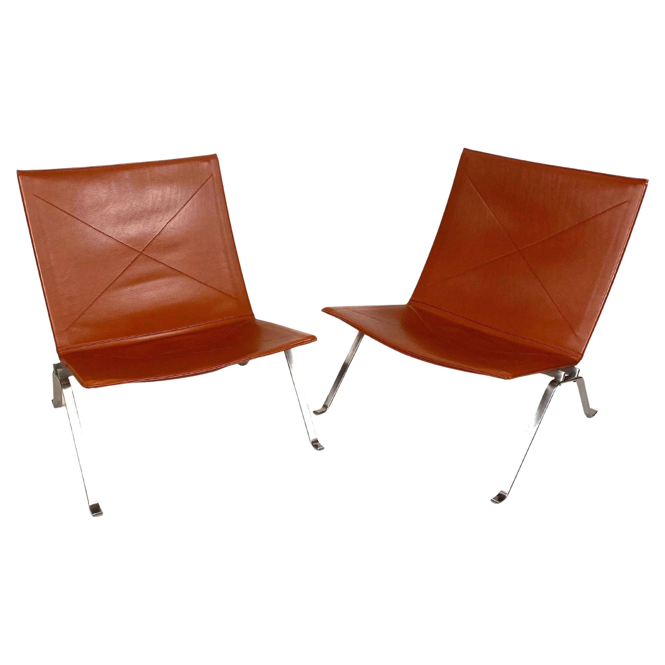 Pareja de sillones PK 22 de Poul Kjaerholm en cuero rojo coñac Dinamarca