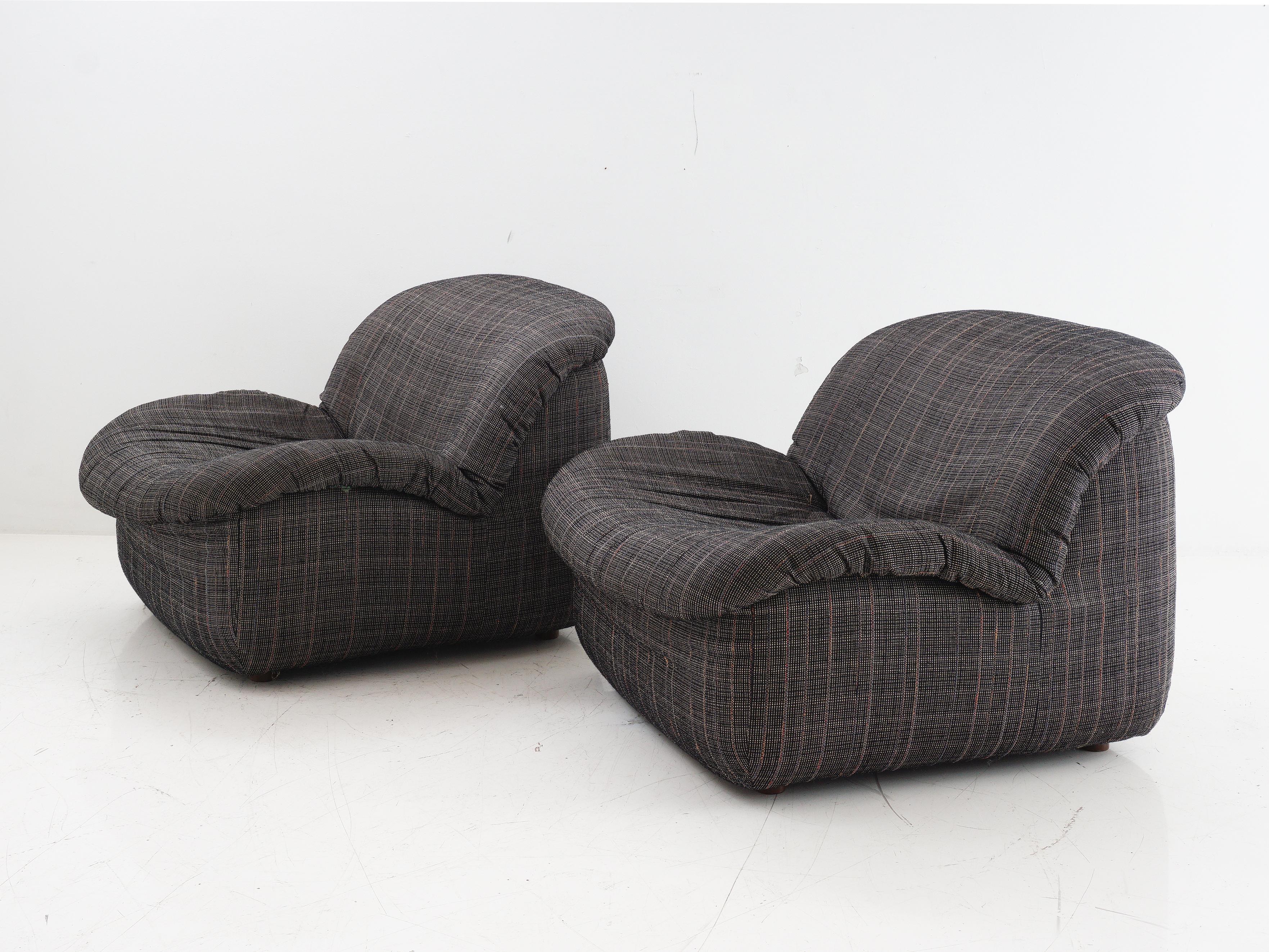 Step into the ultimate comfort zone with these tweed lounge chairs. With a pattern that  rivals your grandma's power suit, these chairs are more than just seating; they're a vintage hug for your living room. Embrace the charm, darling; your living
