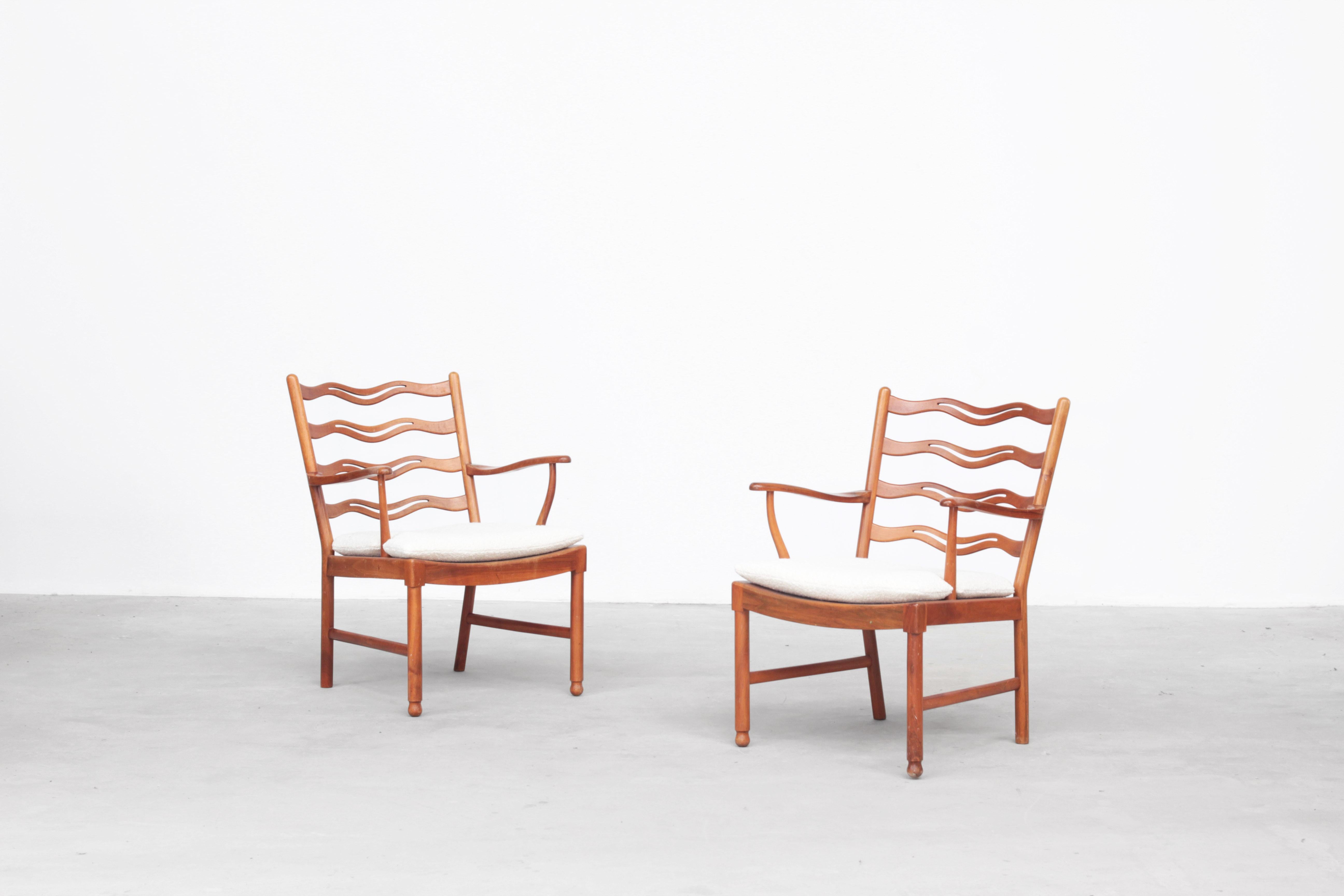 This “Model 1755” armchair was designed by the Danish designer Ole Wanscher and was manufactured by Fritz Hansen in Denmark during the 1940s.

This elegant chair has a refined and slender appearance with a slightly tapered backrest and