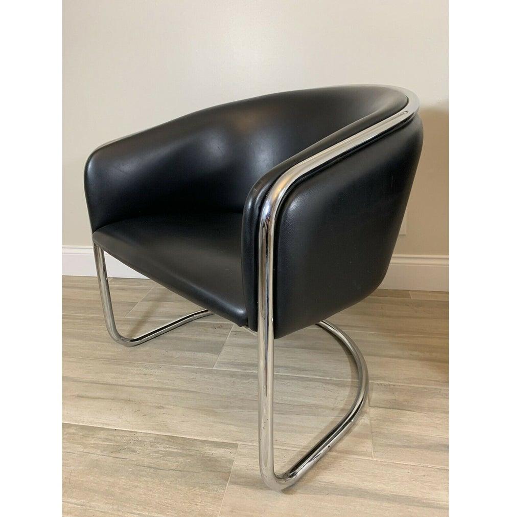 Pair of cantilever dining or lounge chairs by Anton Lorenz for Thonet, circa 1970s. Chrome-plated tubular steel frames. 


Re-upholstery recommended. See photos.

Re-upholstery available for additional fee.



  