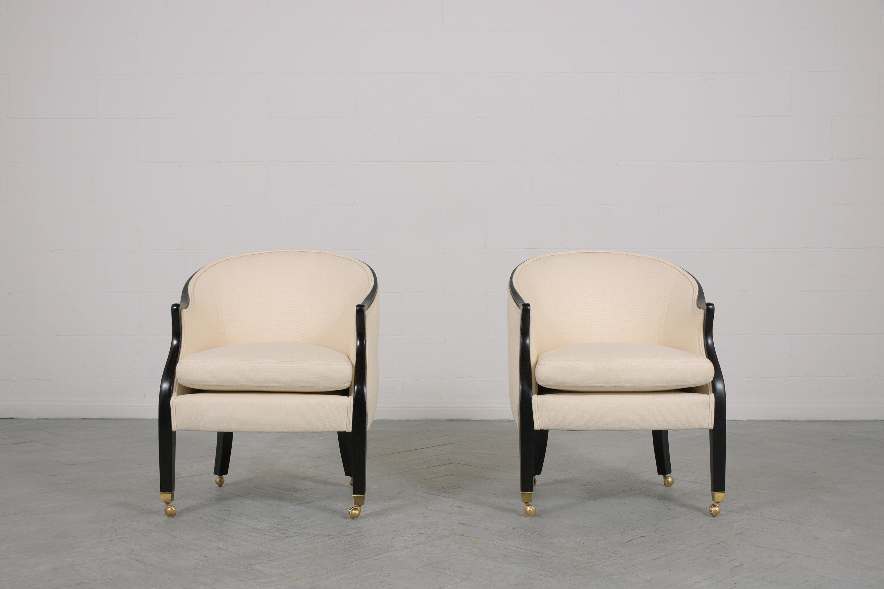 An extraordinary pair of lounge chairs by Baker is beautifully hand-crafted out of mahogany wood in great condition and have been fully restored refinished and upholstered by our expert craftsmen team. This 1960s pair of armchairs features a solid