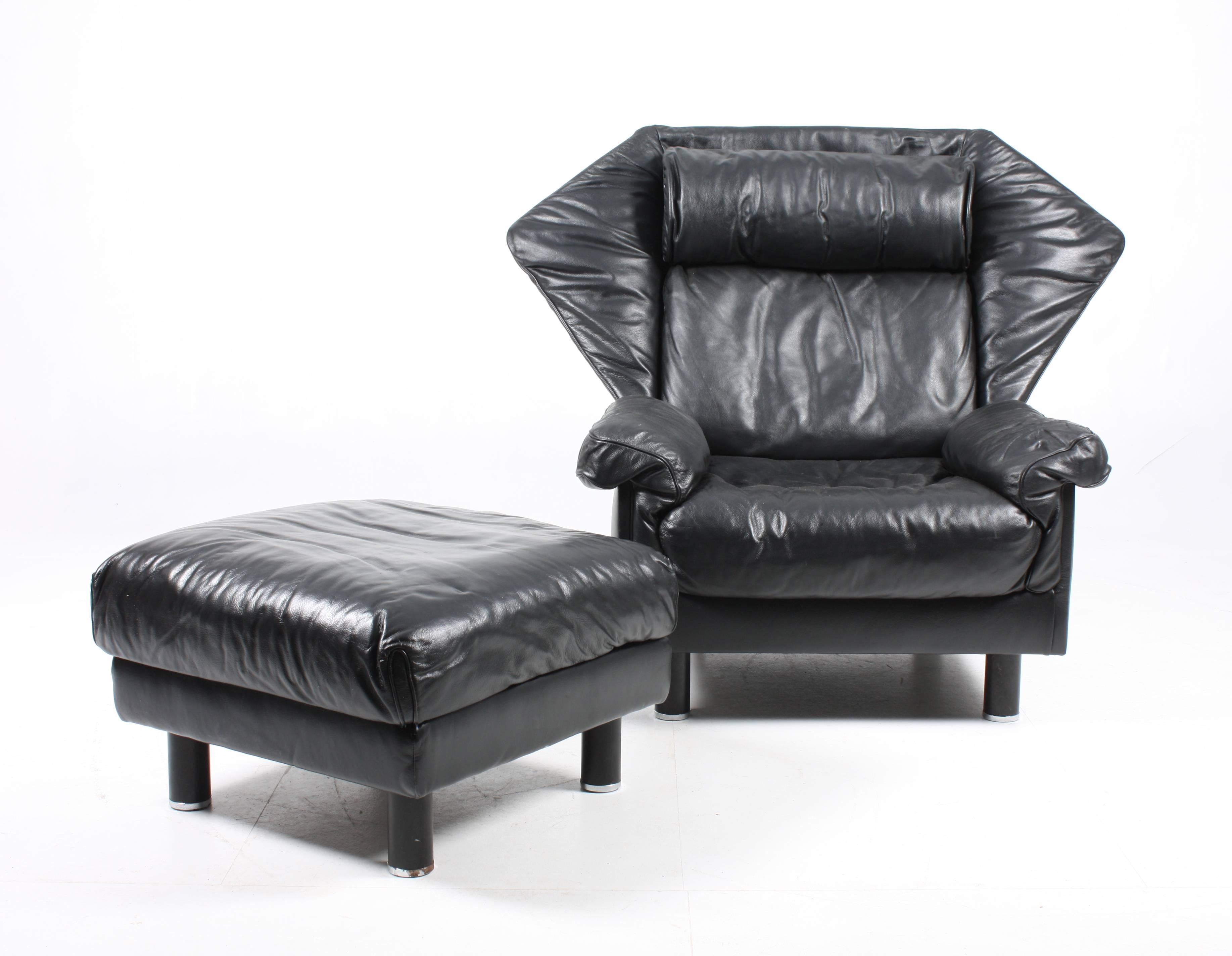 Pair of X large comfortable lounge chairs with one ottoman in patinated leather by De Sede. Great original condition.