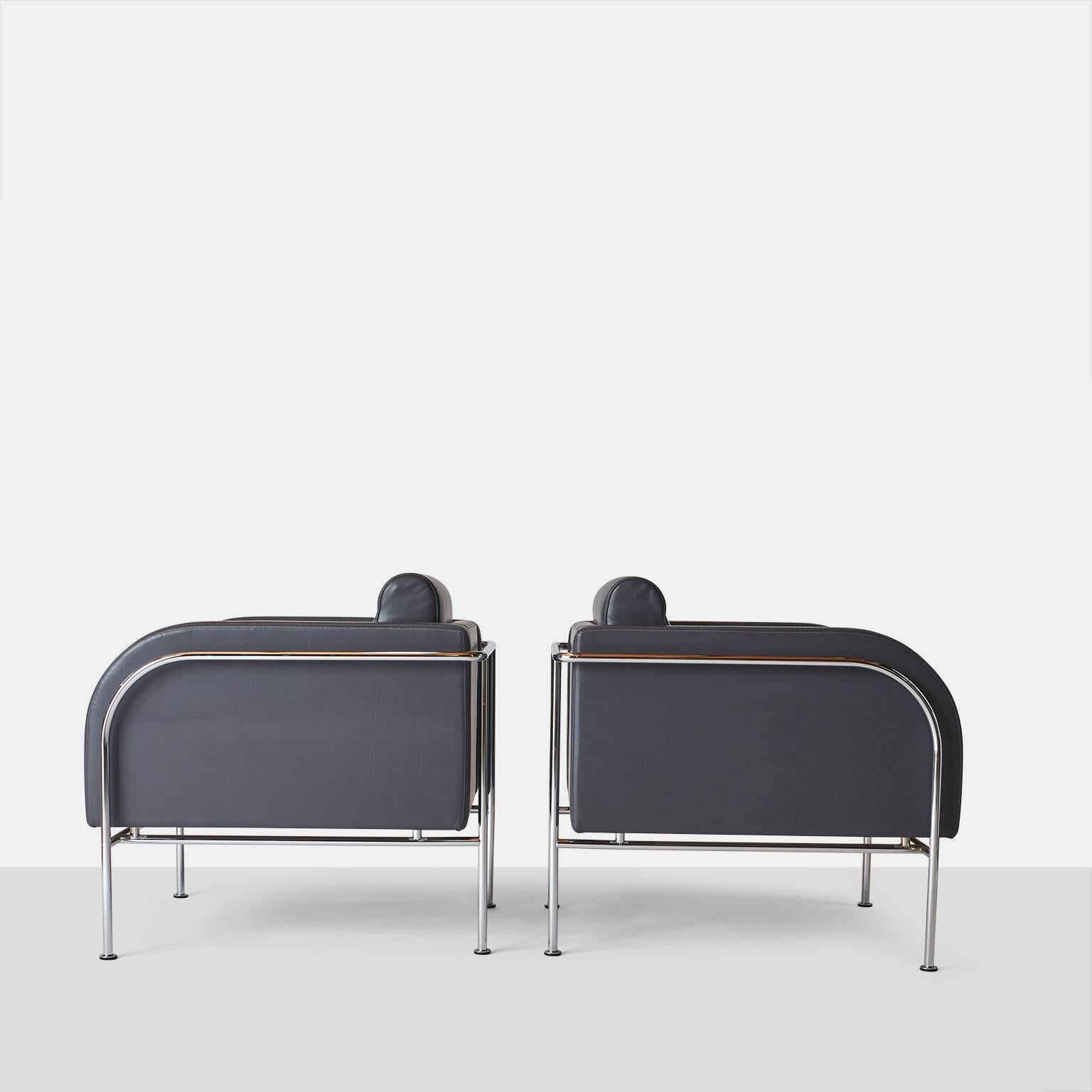 Pair of lounge chairs by Friis & Moltke.
A pair of curved arm lounge chairs for Randers Mobelfabrik. From the 'Series 2000 Lounge'. Chrome-plated tubular steel construction and upholstered in a grey leather. The chairs were designed by the Danish