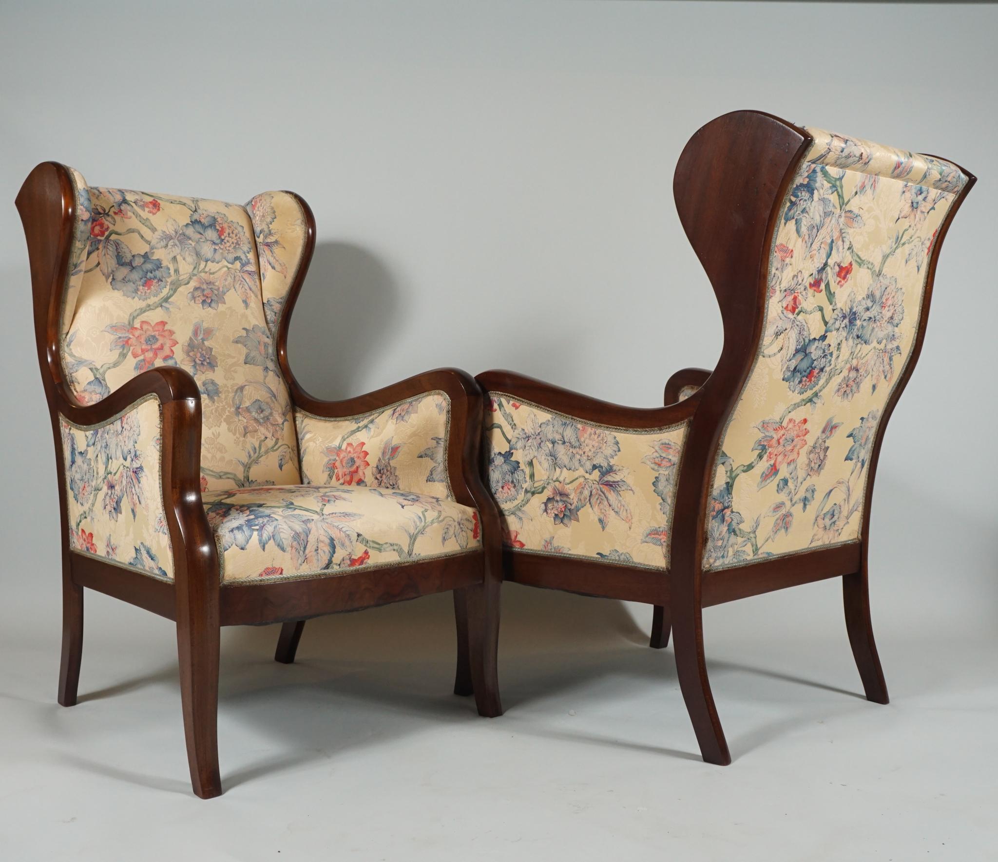 This pair of elegant mahogany-frame armchairs are by Danish Modern Designer, Frits Henningsen,
likely from 1930's. 

Frits Henningsen (1889–1965) was a Danish furniture designer and cabinet maker who achieved high standards of quality with