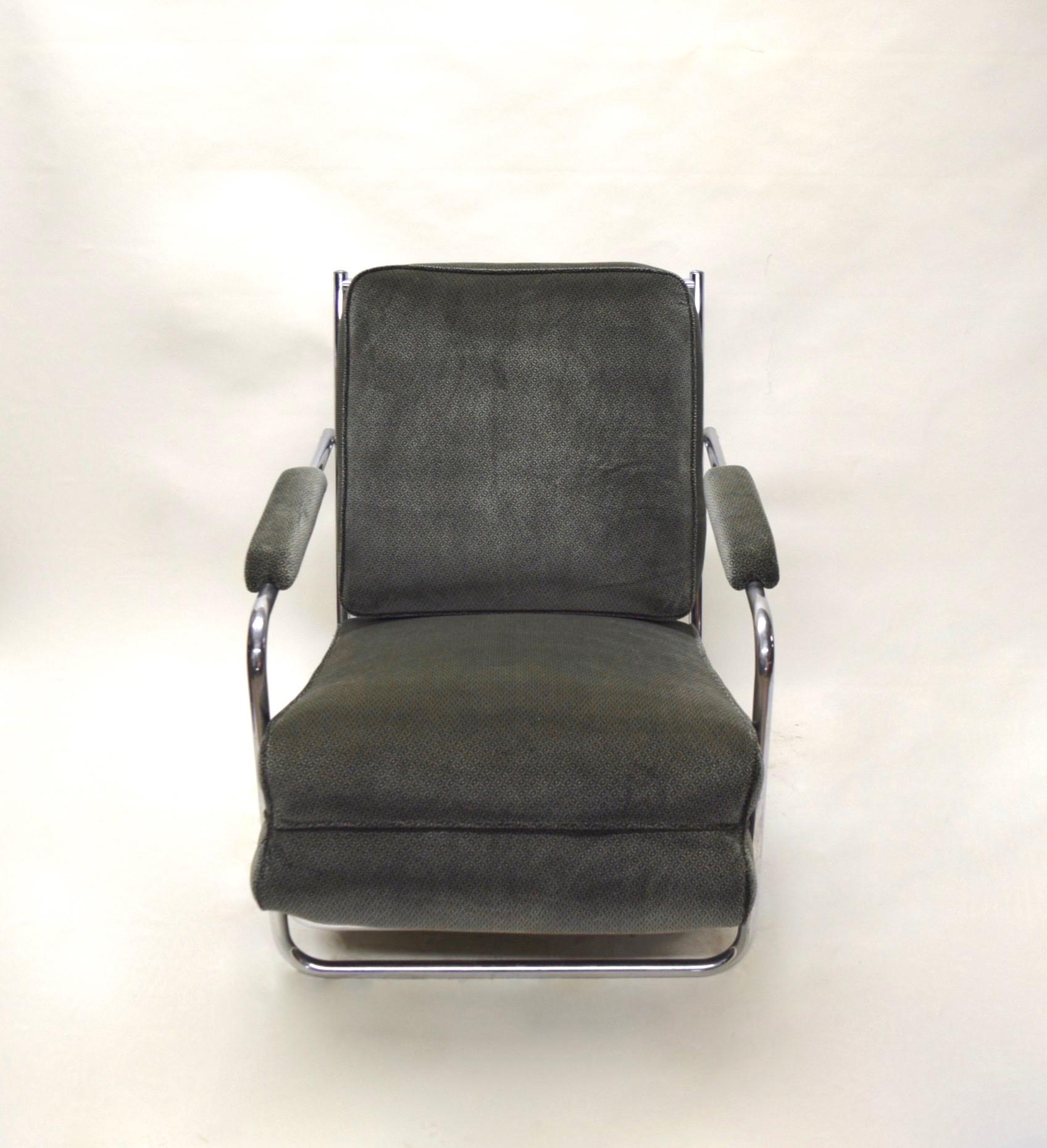 Very comfortable and sturdy pair of Gilbert Rohde designed lounge chairs for the Troy Sunshade Company in chromed tubular metal, original spring cushions in great condition, upholstered arm rests and printed gray velvet fabric.