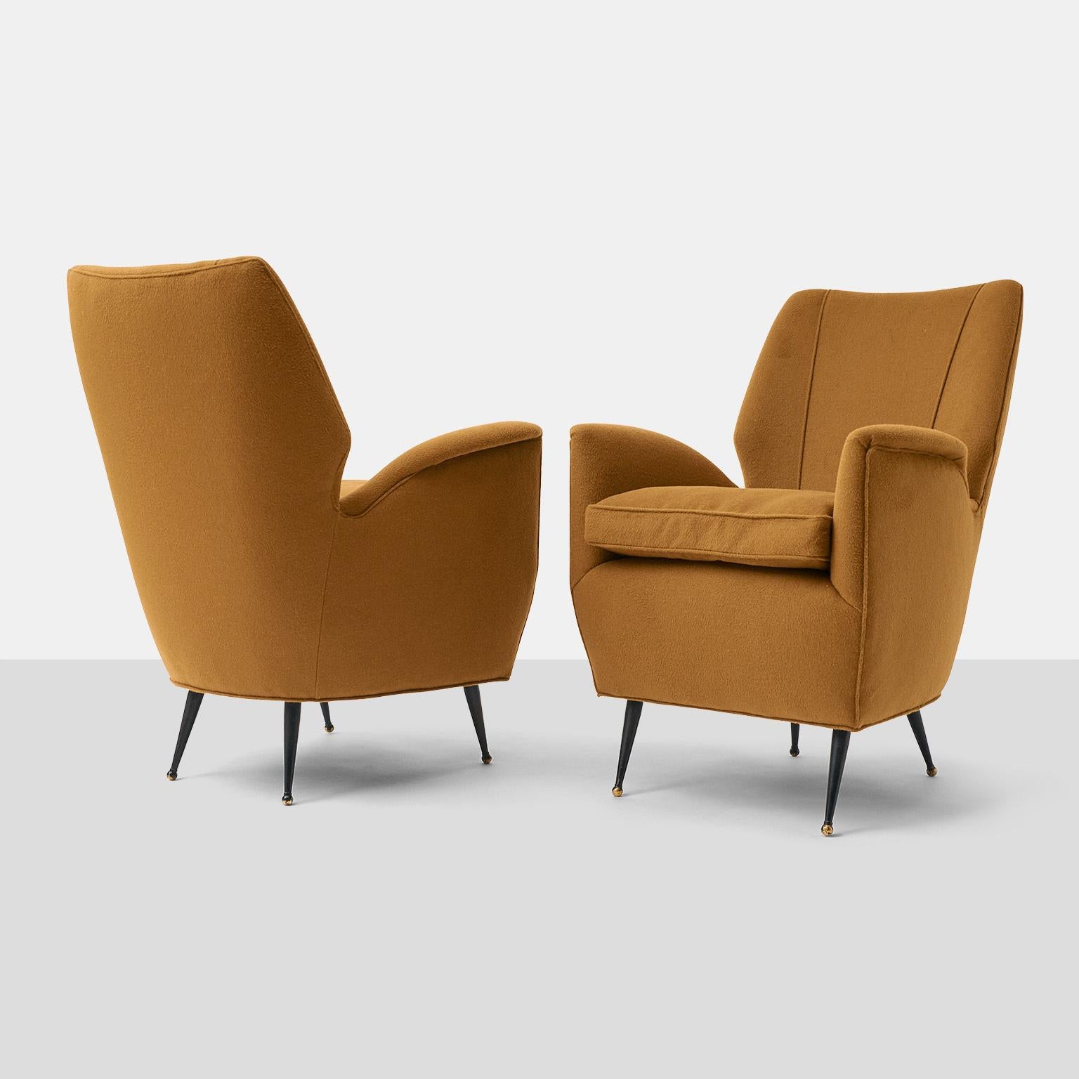 A rare pair of Gio Ponti attributed lounge chairs with brass supports and down filled seat cushions. Lovingly restored, and covered in a luxurious Sandra Jordan Prima Alpaca fabric. Priced individually. 

Measures: 18