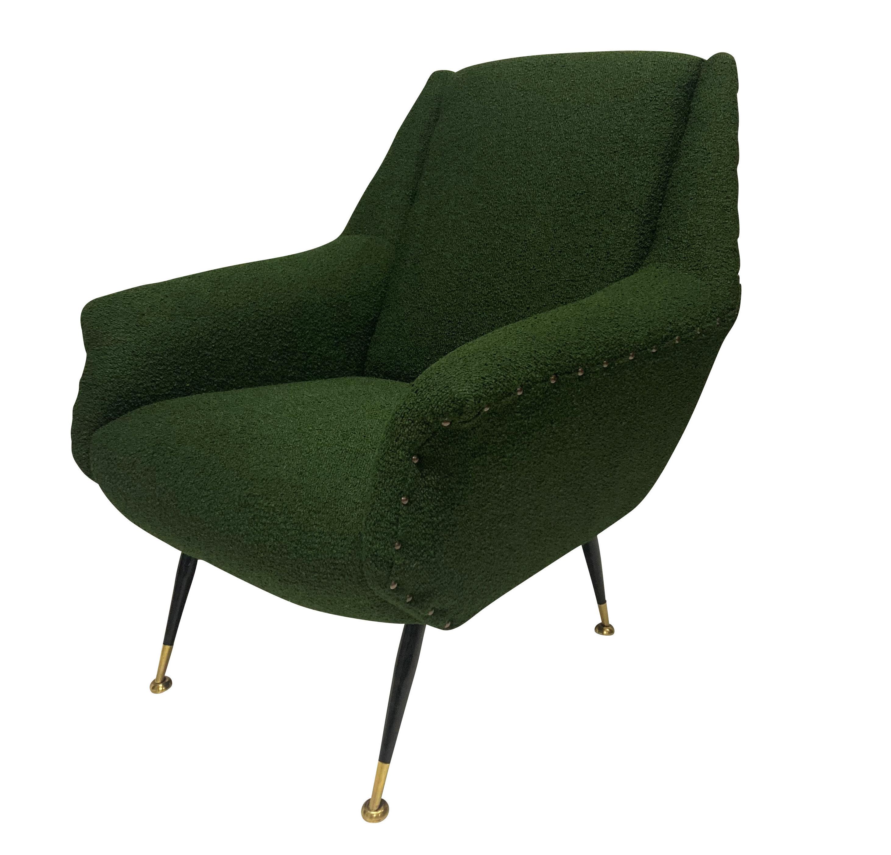 A pair of stylish Italian lounge chairs in the style of Gio Ponti. On tapering steel and brass legs, newly upholstered in dark green boucle with the studding in its original position.