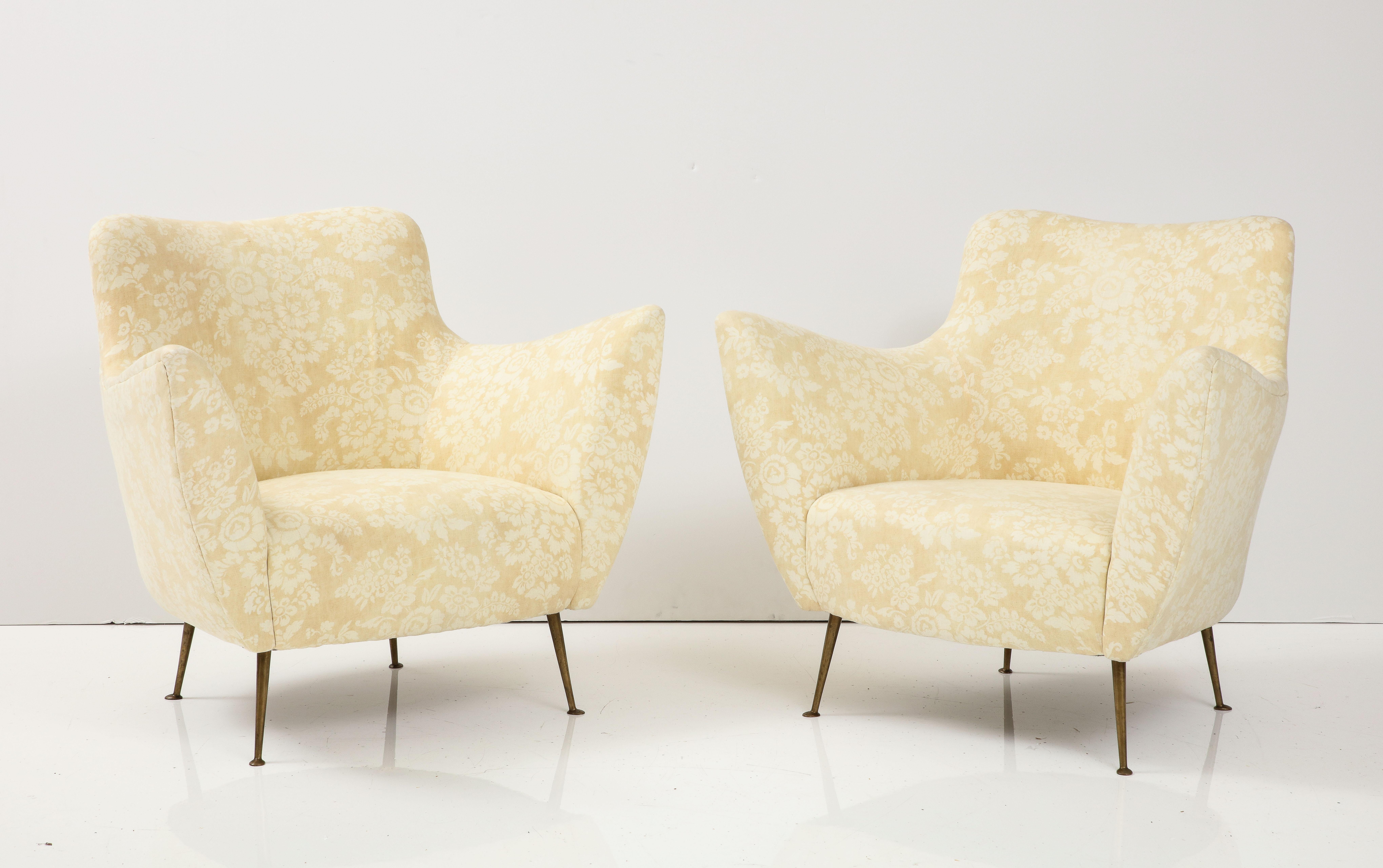 Pair of Lounge Chairs by Guglielmo Veronesi, Italy, c. 1950s. 

These exquisite, sculptural lounge chairs were produced by acclaimed furniture manufacturer ISA Bergamo in the 1950s. They have been newly reupholstered in a yellow floral hemp linen