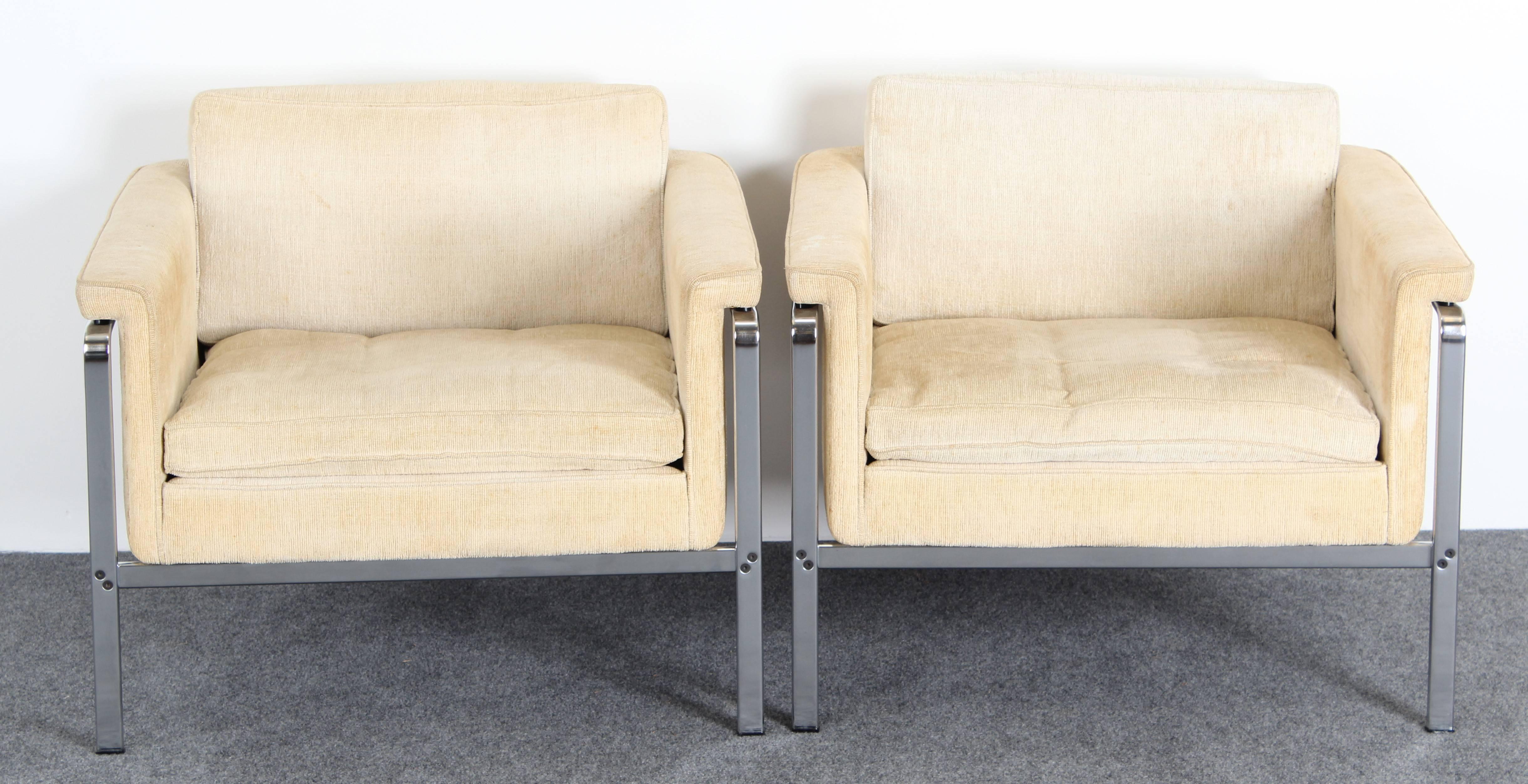 A pair of chic lounge chairs by Horst Bruning for Alfred Kill International, designed in Germany in 1968. Reminiscent of Florence Knoll's parallel bar line of seating  Made of chrome steel with upholstery. Chromed steel is in good condition with age