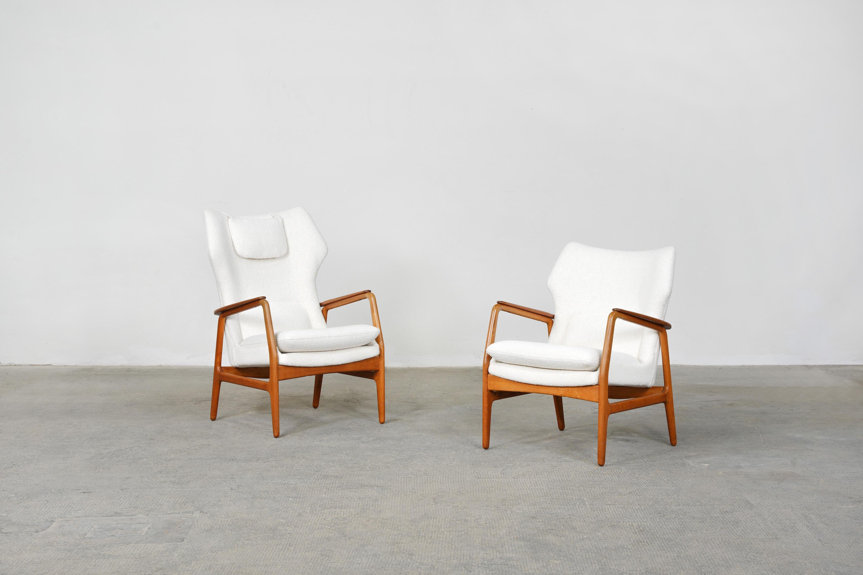 Beautiful pair of lounge chairs designed by the Danish Designers Ib Madsen & Acton Schubell for Bovenkamp, 1954.

The pair is in excellent condition. They were newly reupholstered with a high-quality off-white boucle fabric.
Both chairs come with