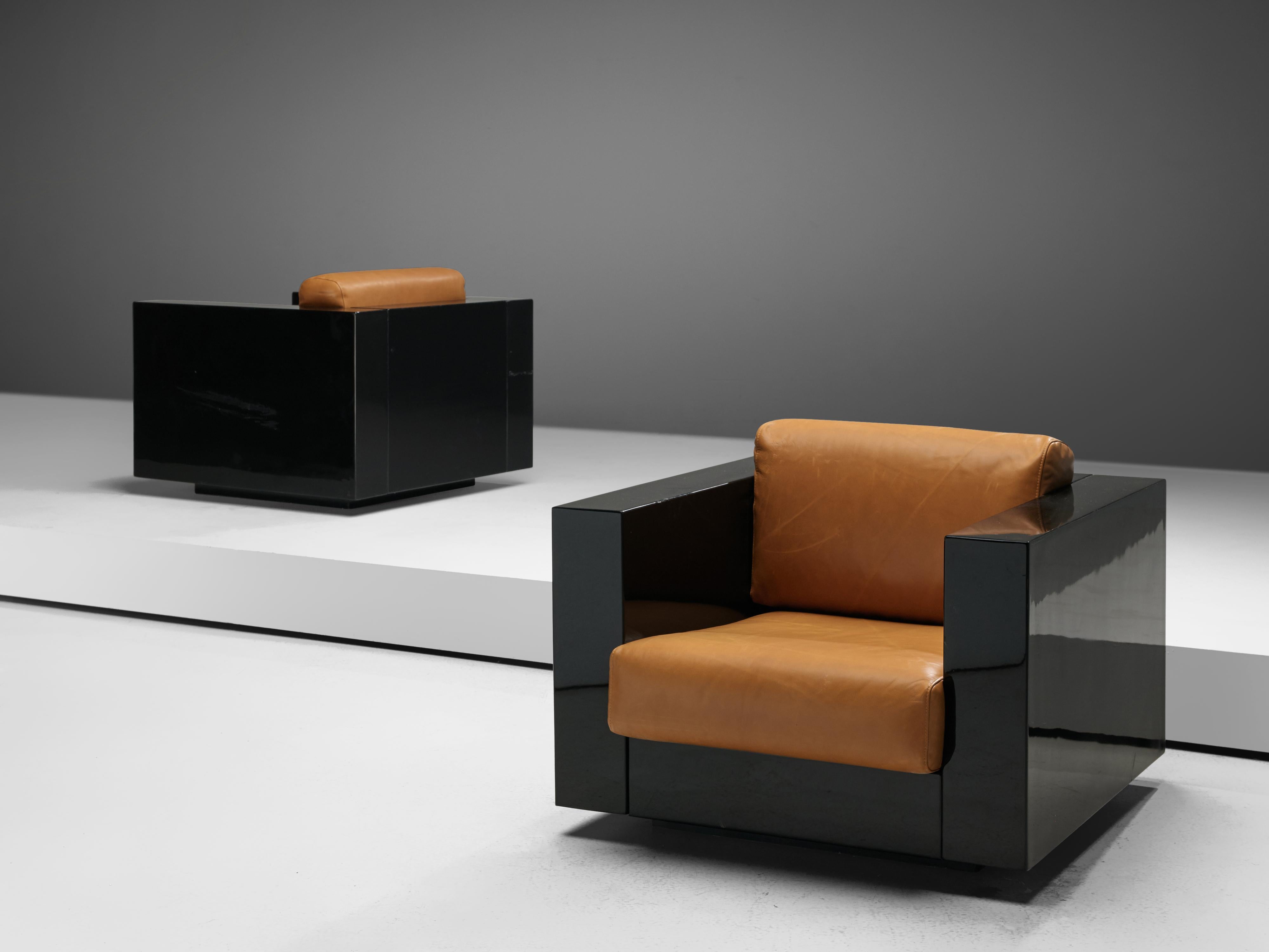 Pair of lounge chairs, Lella & Massimo Vignelli, black lacquered polyester and cognac leather, Italy, 1964.

Massimo and Lella Vignelli for Poltronova designes the Saratoga living room set in black lacquered polyester and cognac leather in 1964. The