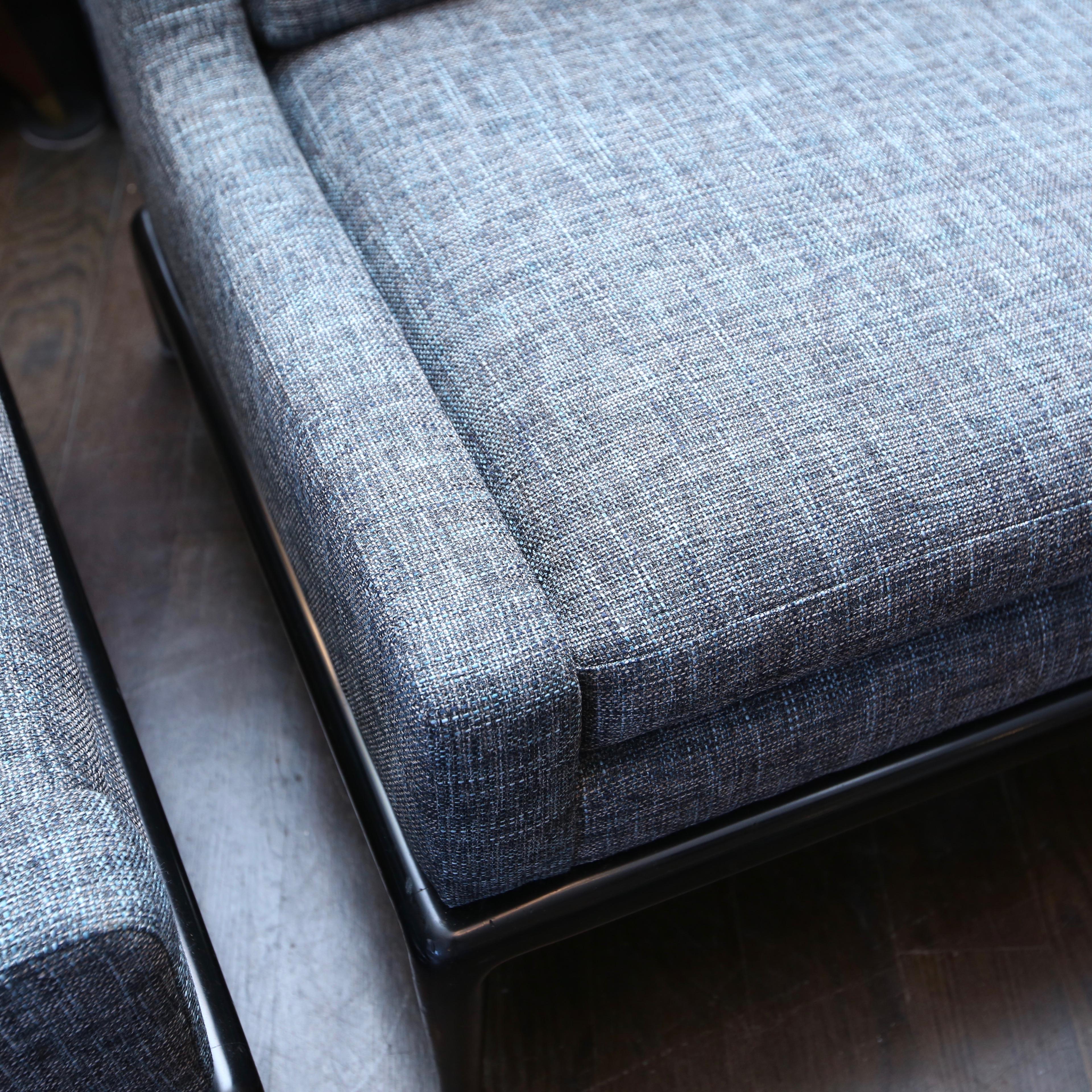 1980s era lounge chairs that have just been reupholstered in a cool fabric with shades of blue, black and grey.