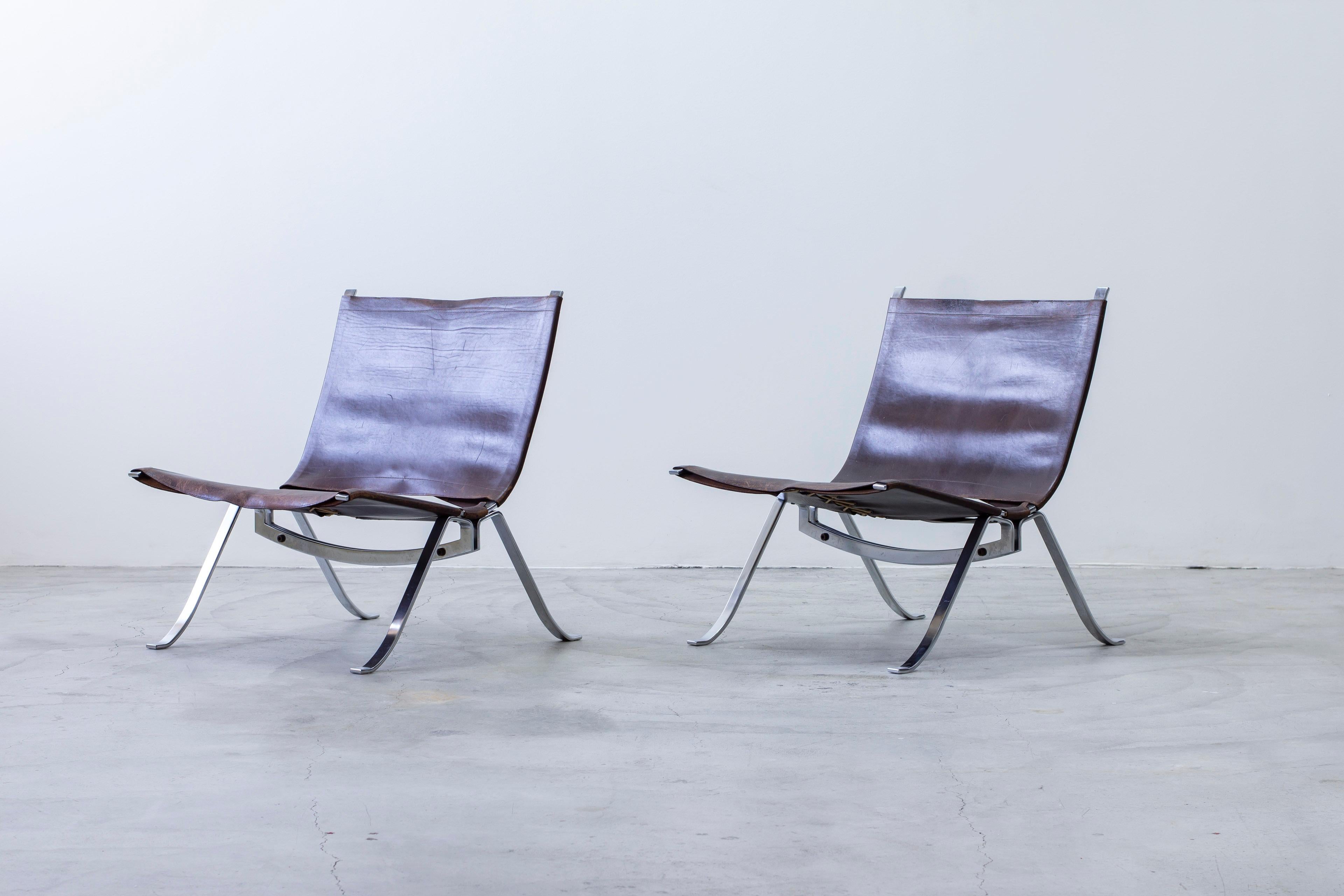 Pair of lounge chairs designed by Preben Fabricius. Produced by Arnold Exclusiv around 1972. Very well made and only in production during a brief while. Made from thick chromed steel and deep brown core leather stitched together with thick rope in
