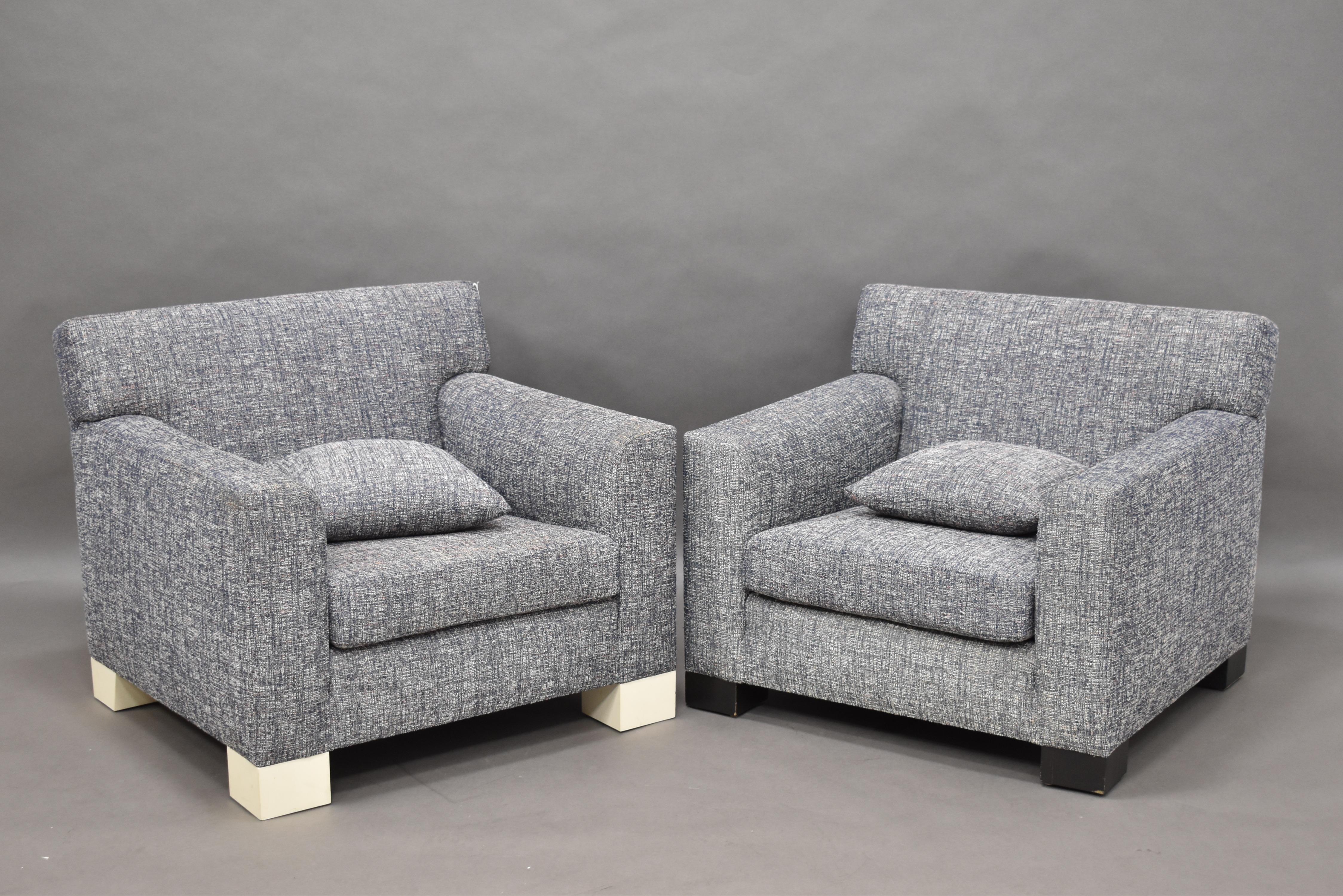 Beautiful original pair of squared and geometric lounge chairs by Roy McMakin. Original basket weave grey/white/steel blue upholstery, with loose seat cushion and square throw pillow. One example with black painted finish feet, another with white