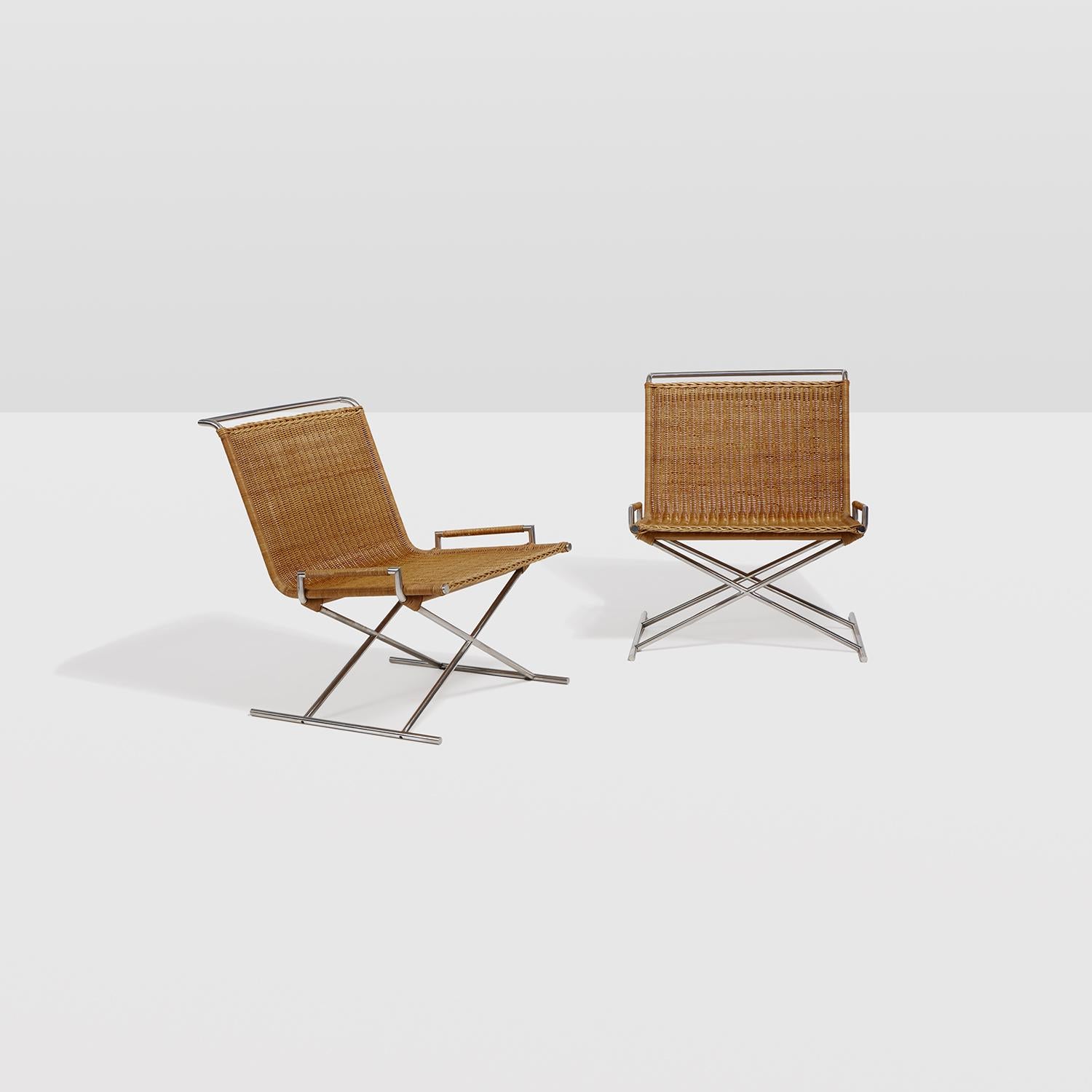 Pair of X based chrome steel and rattan lounge chairs designed by Ward Bennett for Brickel Associates.
