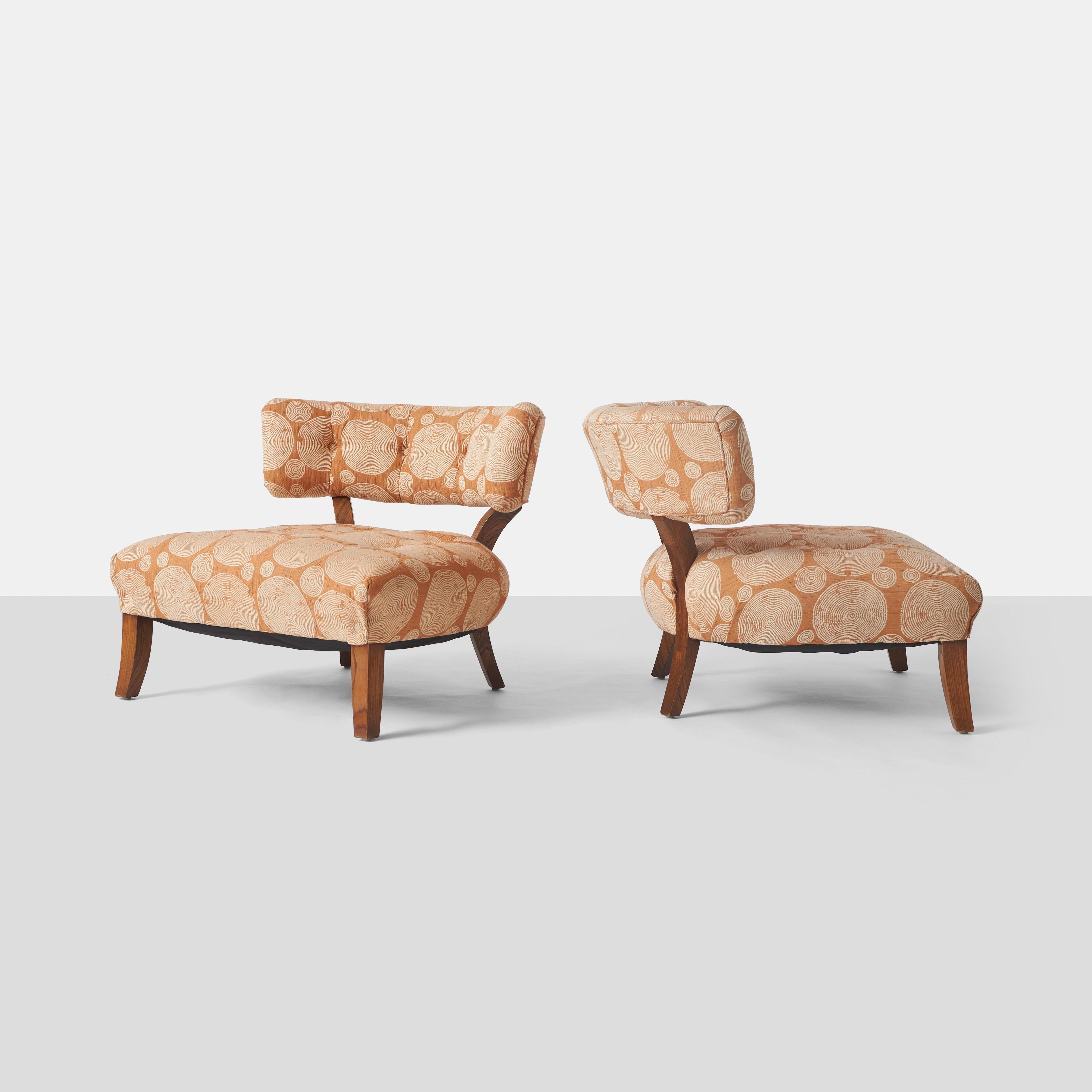 Two large scale lounge chairs designed by William 
