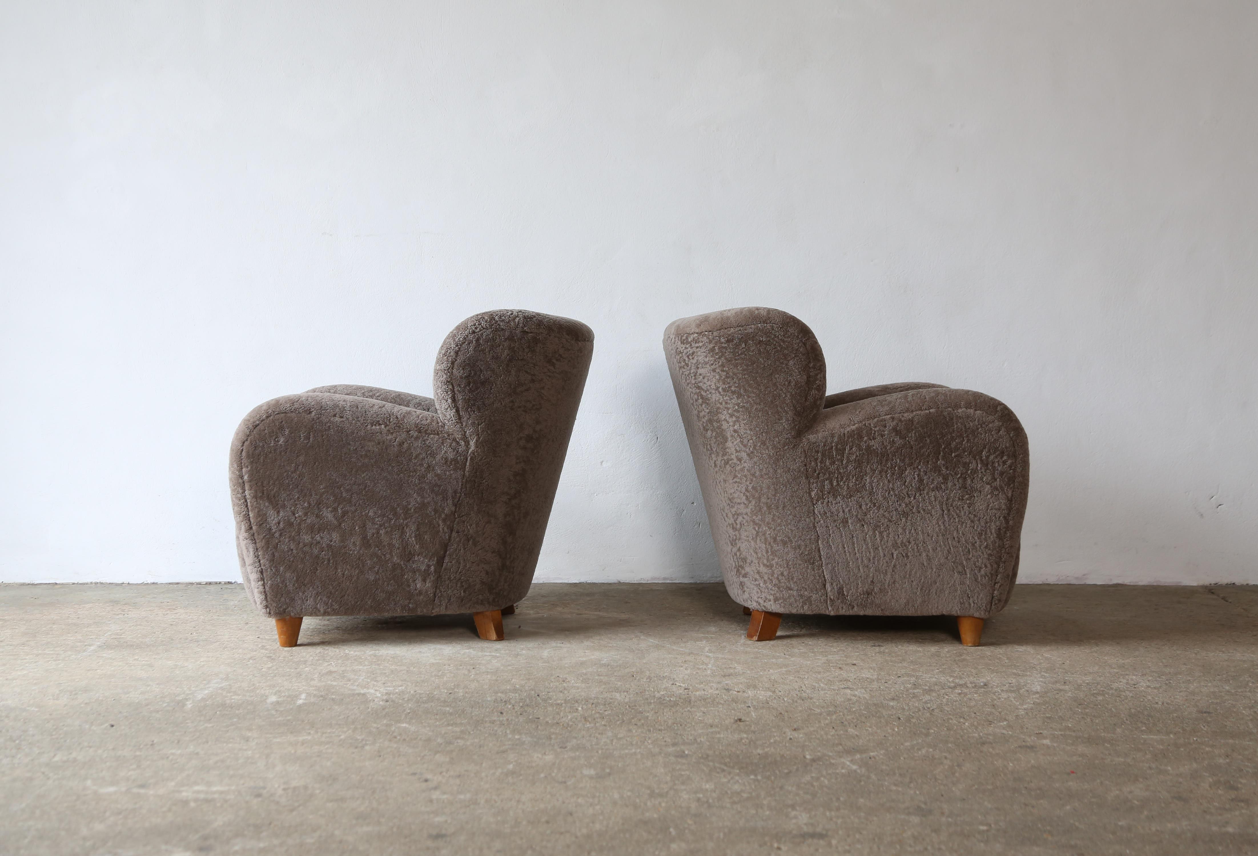 Wood Pair of Lounge Chairs, Denmark, 1950s, Newly Upholstered in Sheepskin For Sale