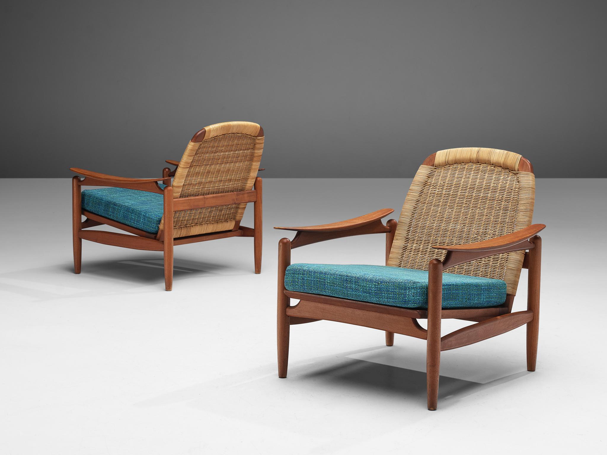 Pair of lounge chair, teak, cane, fabric upholstery, Denmark, 1960s

Comfortable lounge chairs with beautiful frame. This chair is simplistic yet elegant and modern in design. Due to the structured frame, it has a very sculptural feel. The sleek