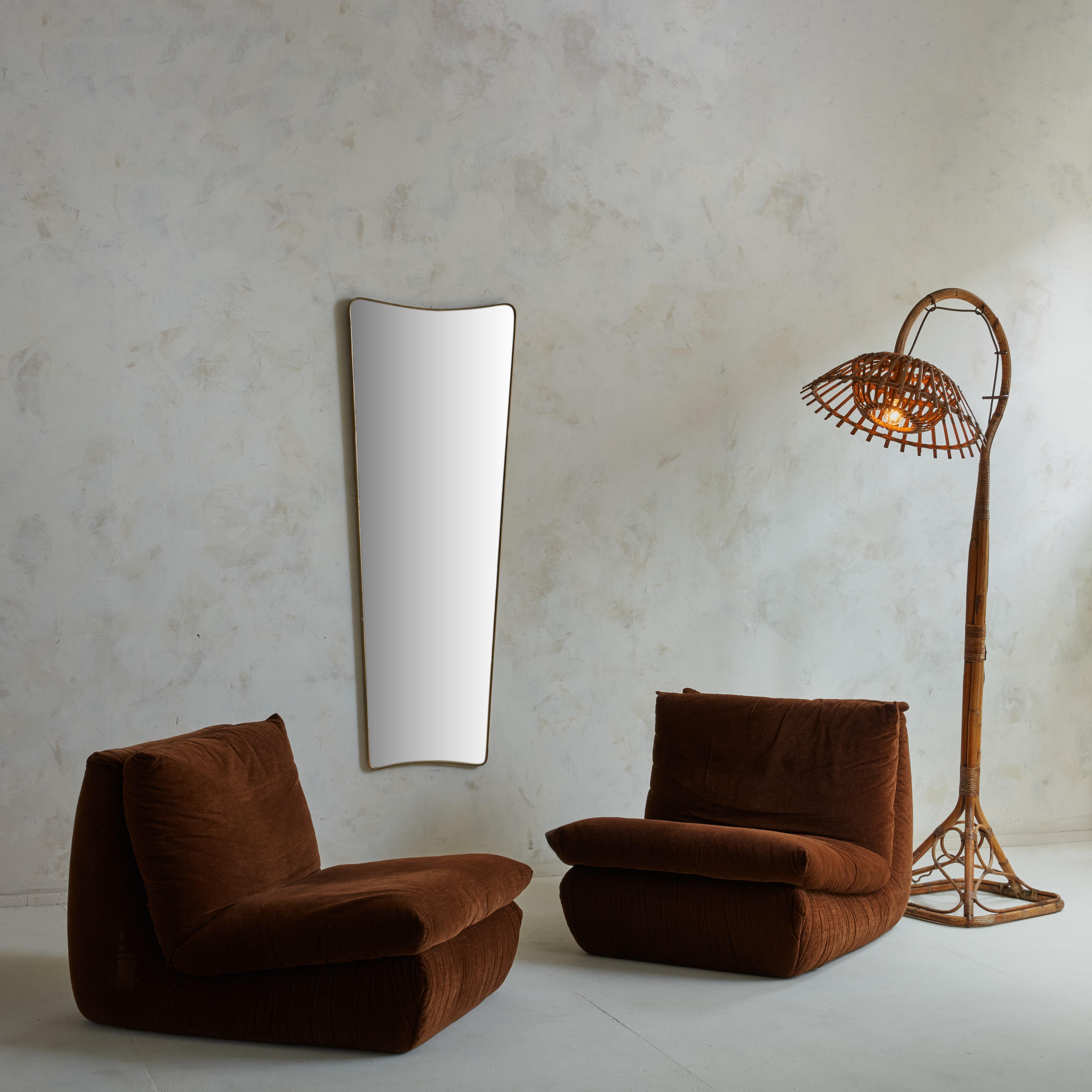 A beautiful pair of Cinna lounge chairs in an original sophisticated chocolate brown fabric. These comfortable chairs are the result of years of research, collaborations with great designers and french craftmanship.

The Roset Company, which owns