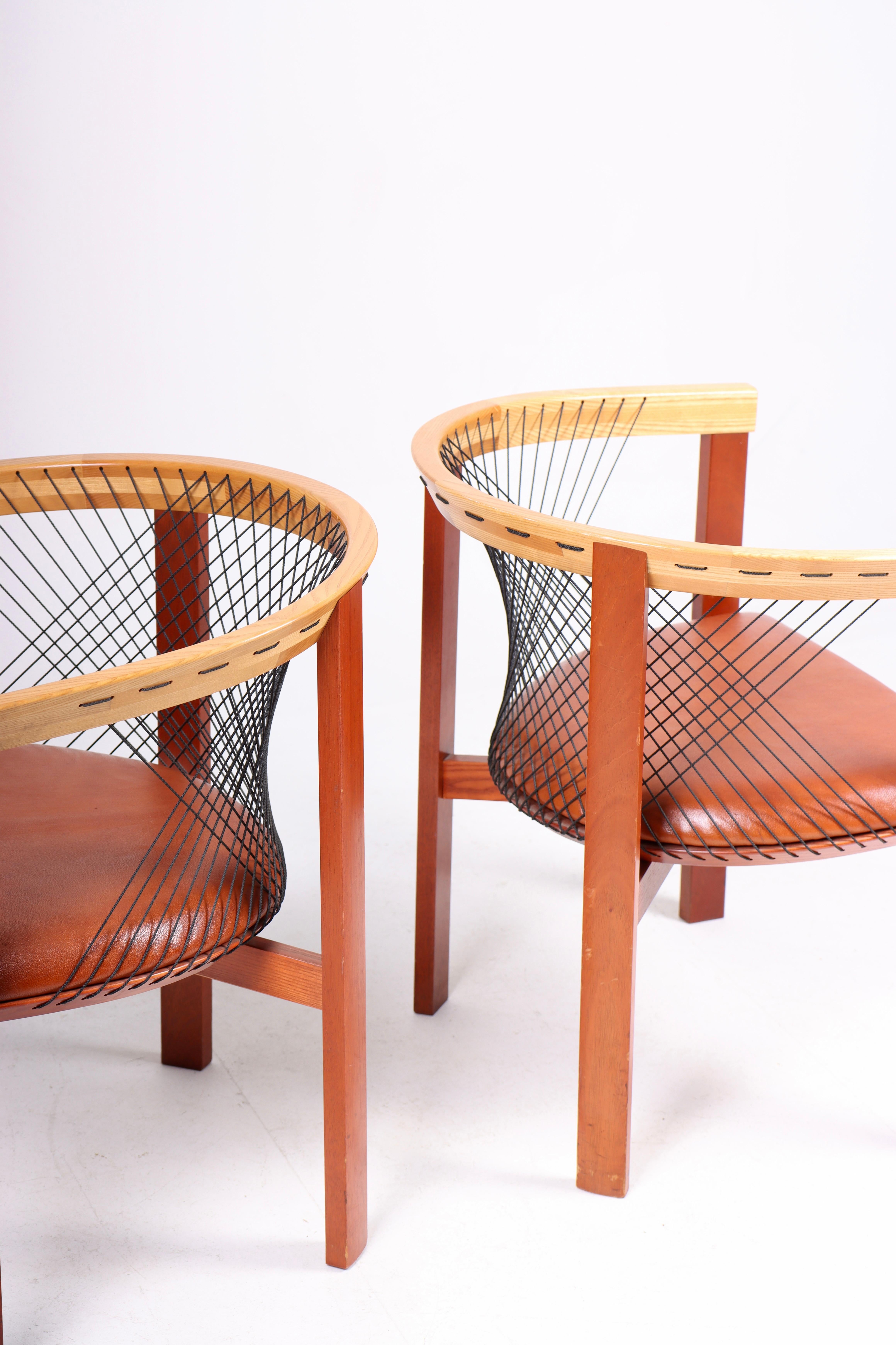 Late 20th Century Pair of Lounge Chairs in Elm and Patinated Leather by Niels Jørgen Haugesen