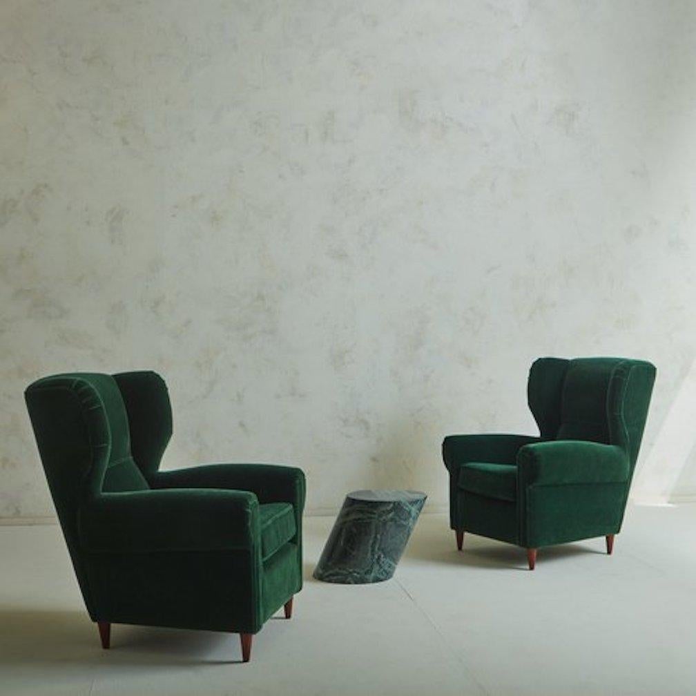 emerald studded curved armchair