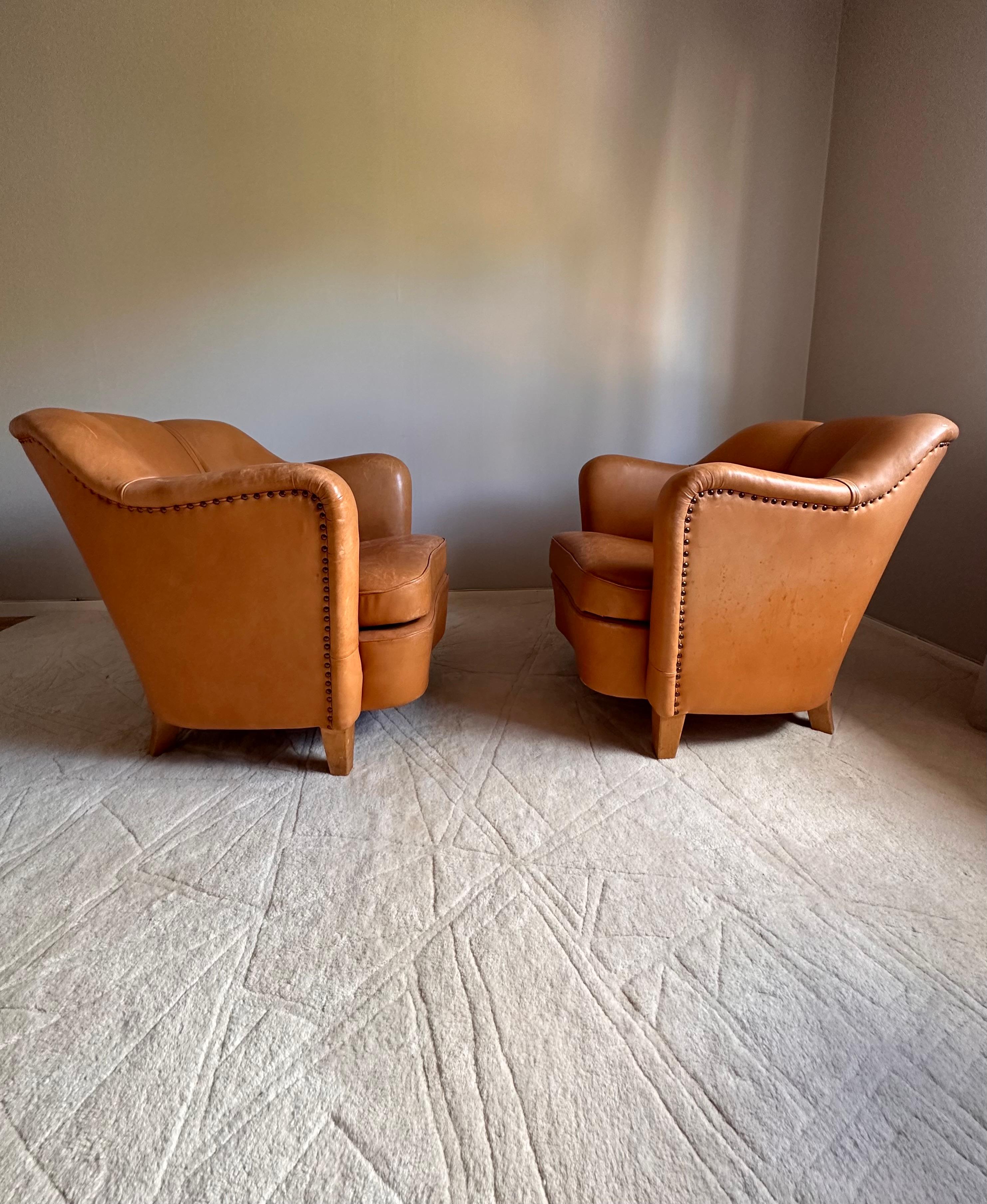 Mid-Century Modern Easy chairs, upholstered in leather,  Scandinavian -50s