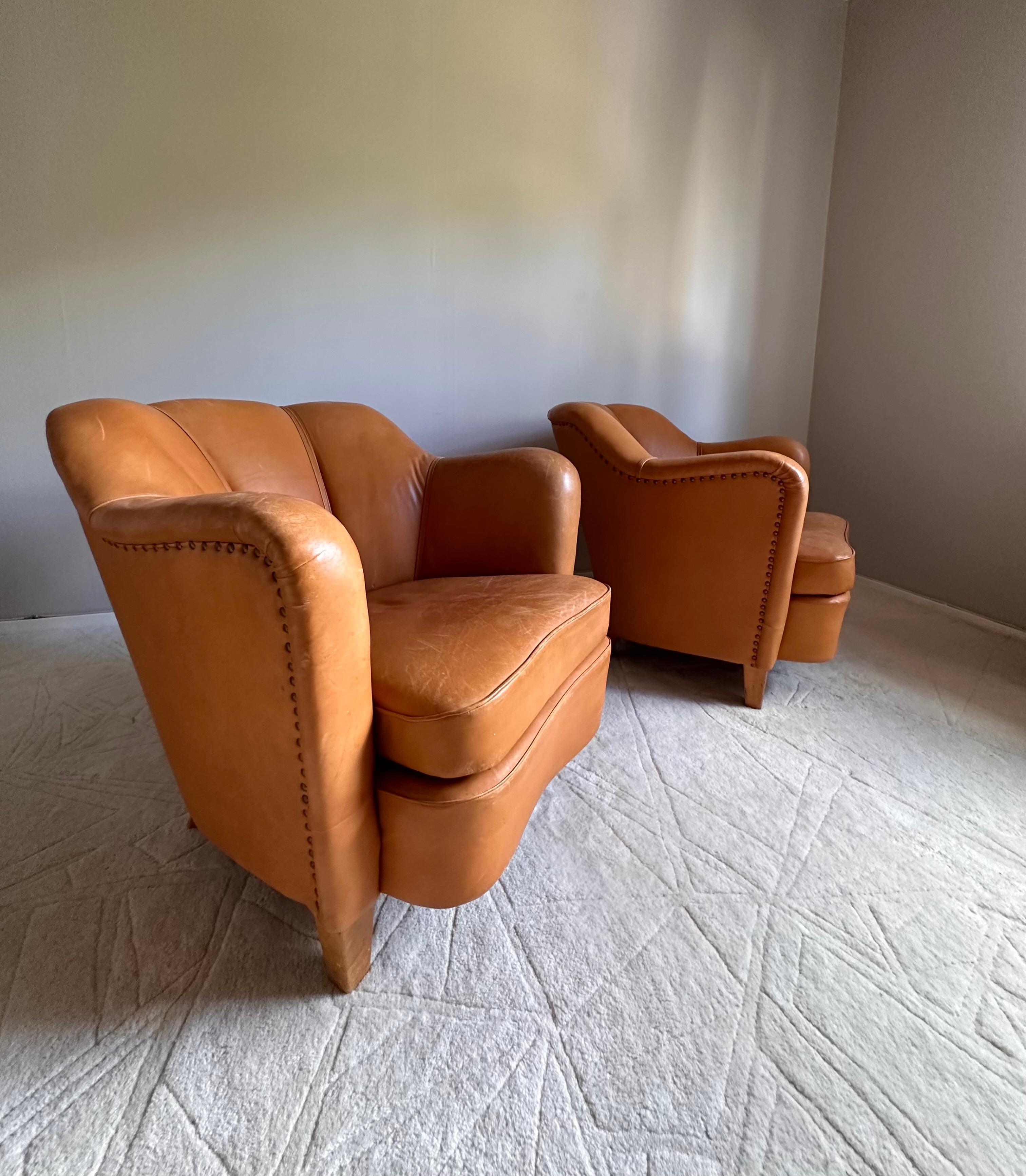 20th Century Easy chairs, upholstered in leather,  Scandinavian -50s