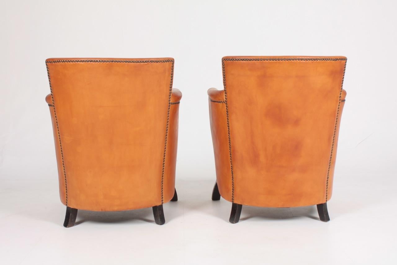 Pair of Lounge Chairs in Patinated Leather and Boucle Designed by Otto Schulz 5