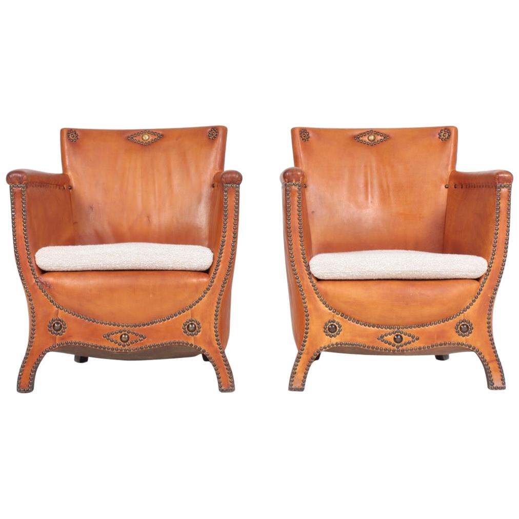 Pair of Lounge Chairs in Patinated Leather and Boucle Designed by Otto Schulz