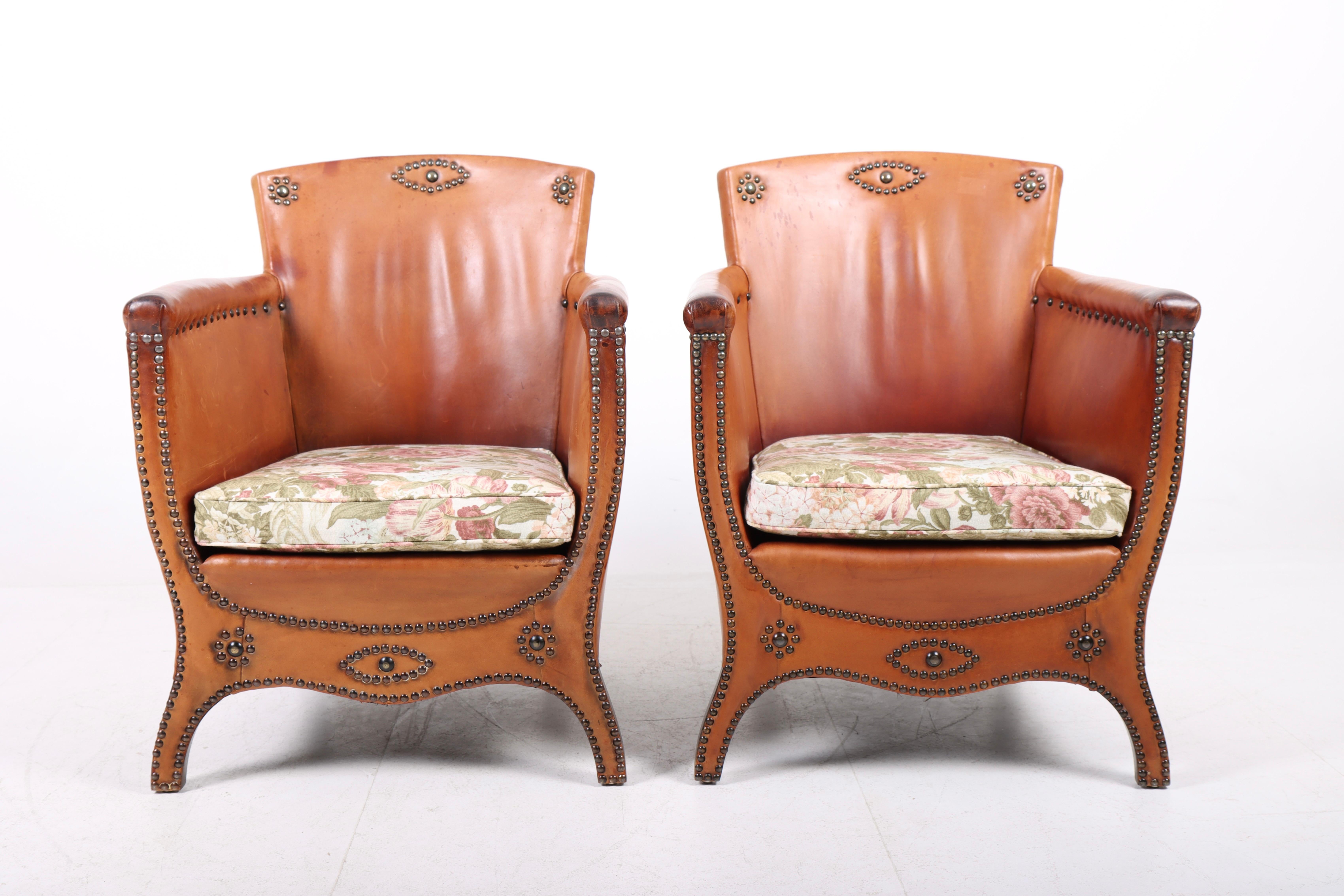 Pair of lounge chairs in leather and fabric. Designed by Otto Schulz and made by Boet AB. Great condition.
  
