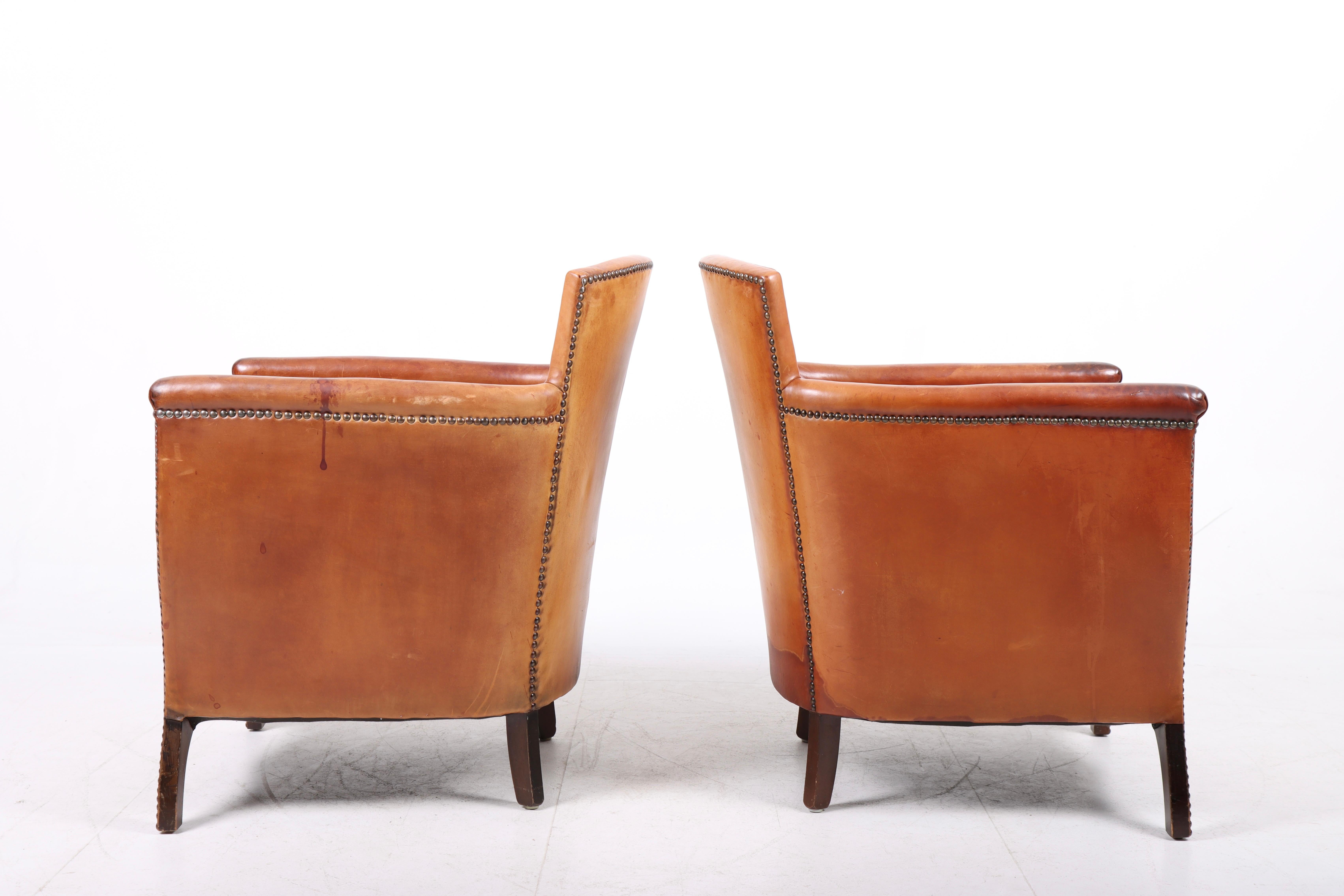 Pair of Lounge Chairs in Patinated Leather and Fabric, Designed by Otto Schulz 2