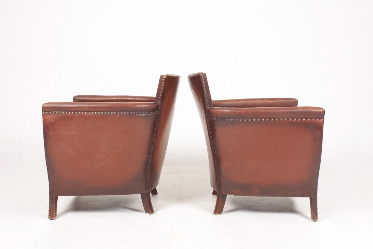 Pair of Lounge Chairs in Patinated Leather Designed by Otto Schulz 4