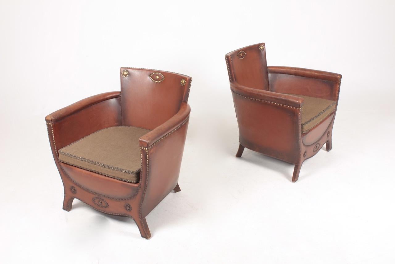 Pair of lounge chairs in leather and fabric. Designed by Otto Schulz and made by Boet AB. Great condition.