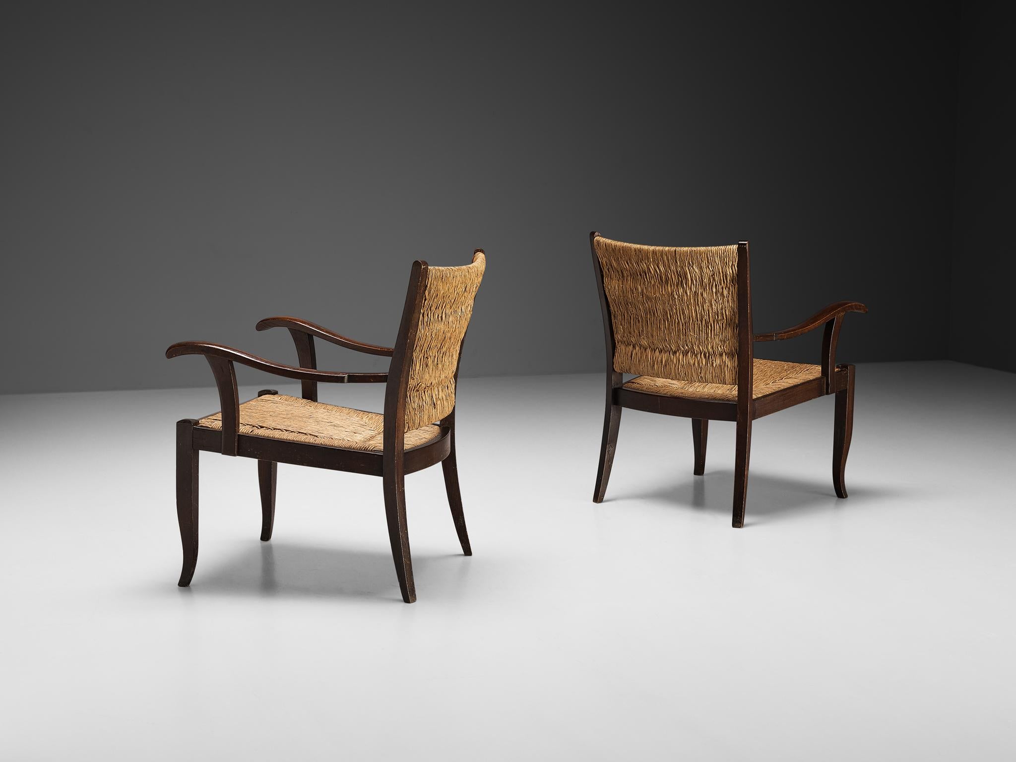 Pair of armchairs, straw, lacquered wood, Europe 1950s

In the refined atmosphere of 1950s Europe, these distinguished armchairs crafted from straw and lacquered wood exude timeless elegance. Their simple yet superb design reflects the era's