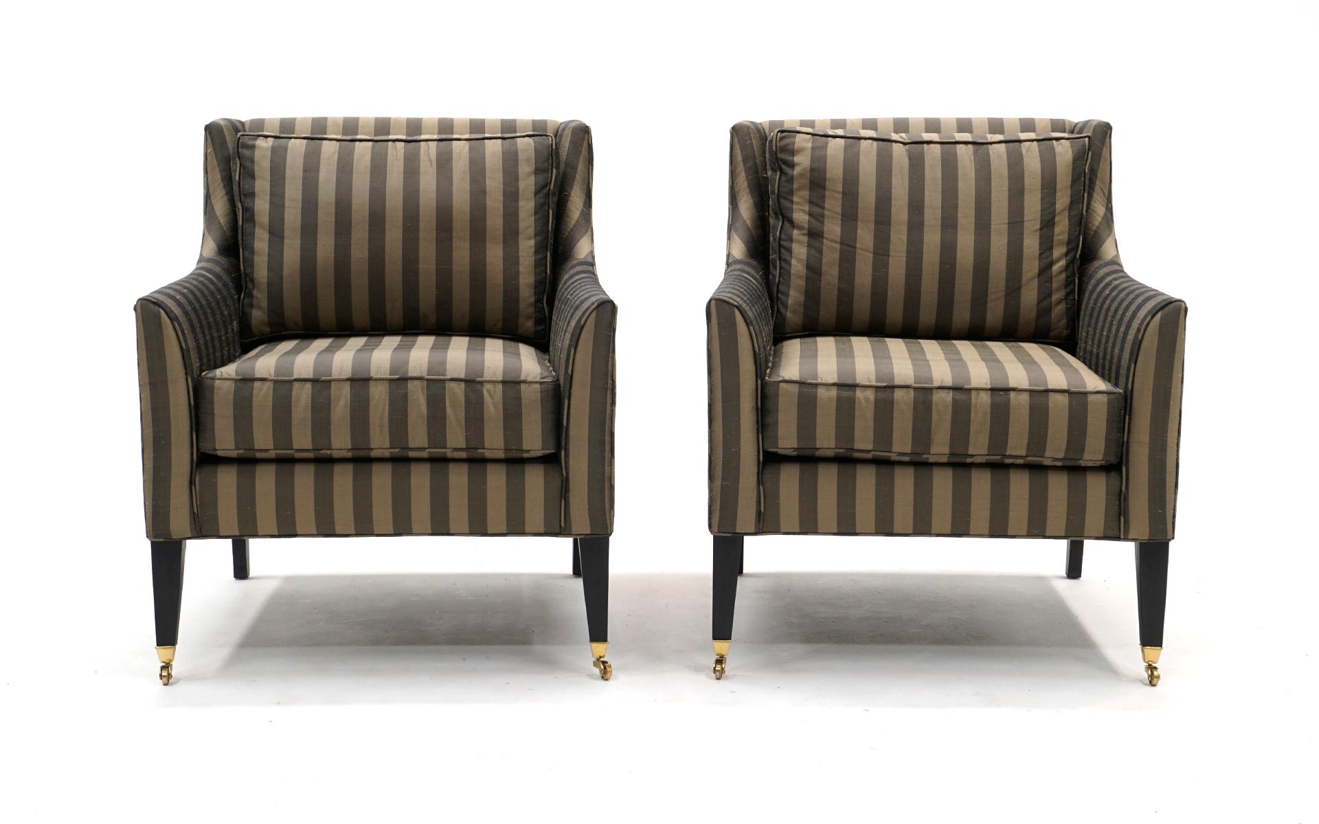 Pair of Lounge Chairs in the style of Edward Wormley for Dunbar. Elegant striped upholstery in tan and gray. Comfortable and ready to use.