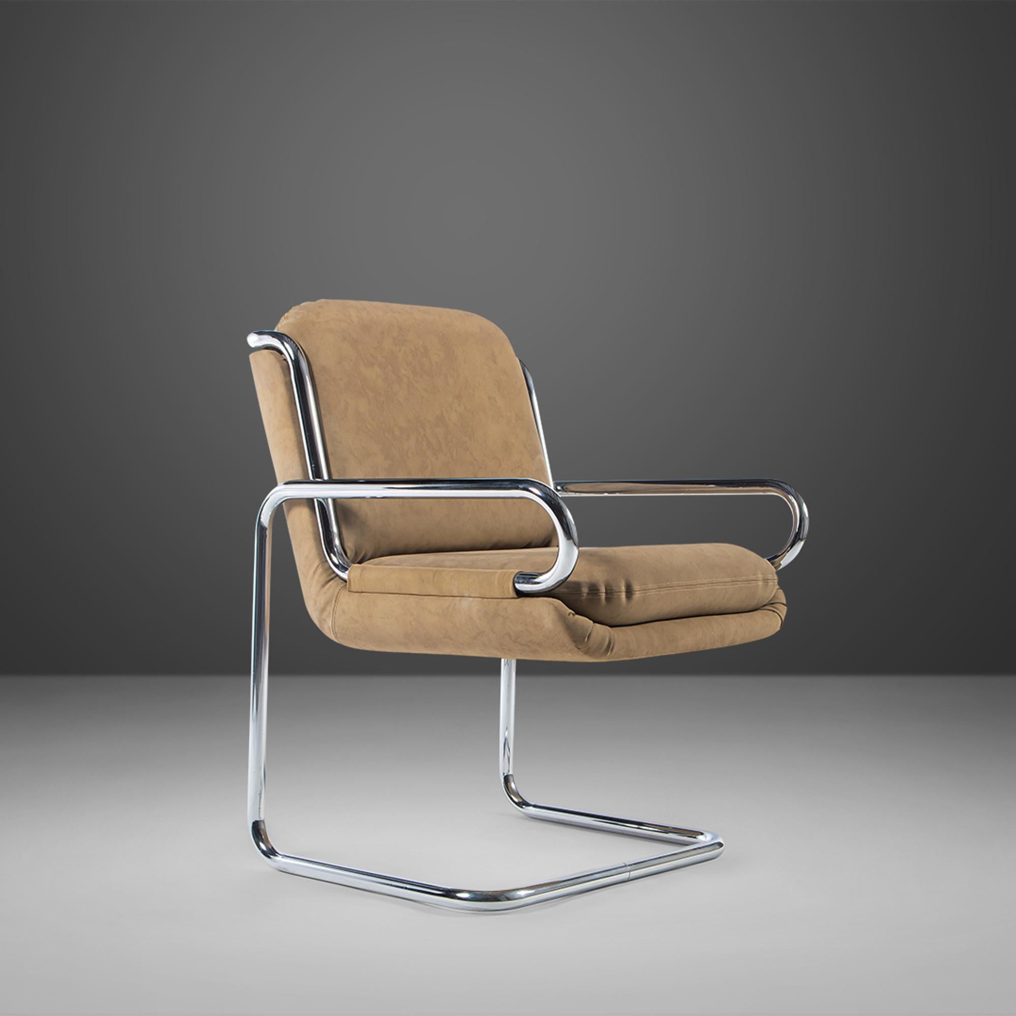 Constructed from tubular chrome. The seats are found in a camel micro suede fabric. 1970s.

---Dimensions---
Width: 24.5 in / 62.23 cm
Depth: 28 in / 71.12 cm
Height: 34 in / 86.36 cm
Seat Height: 20 in / 50.8 cm

This striking set of chairs is in