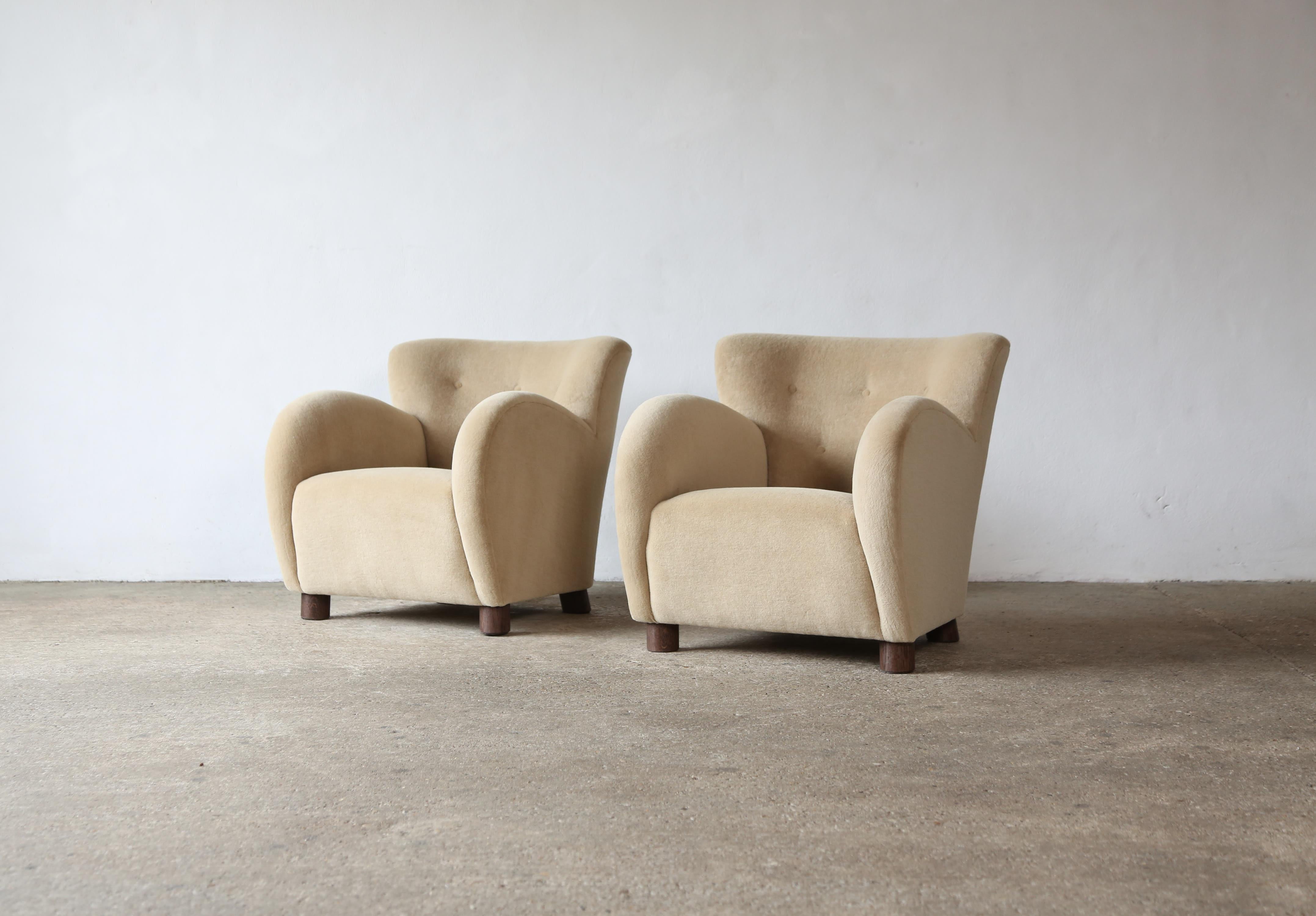 A superb pair of modern round arm armchairs. Handmade beech frames, sprung seat and newly upholstered in a premium, beige / sand, soft, pure alpaca wool fabric with solid oak feet. Fast shipping worldwide.



